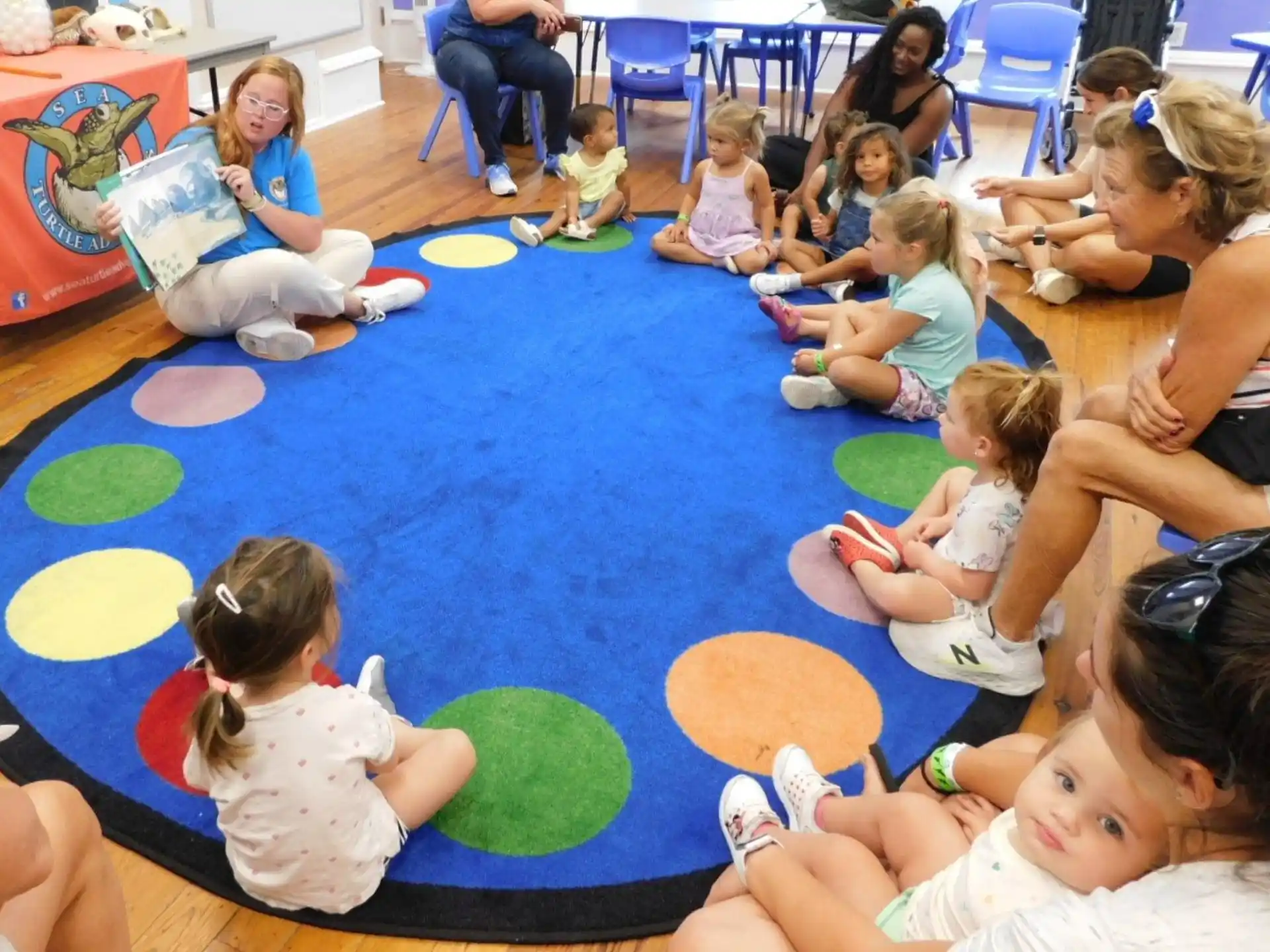 a group of children sitting on the floor