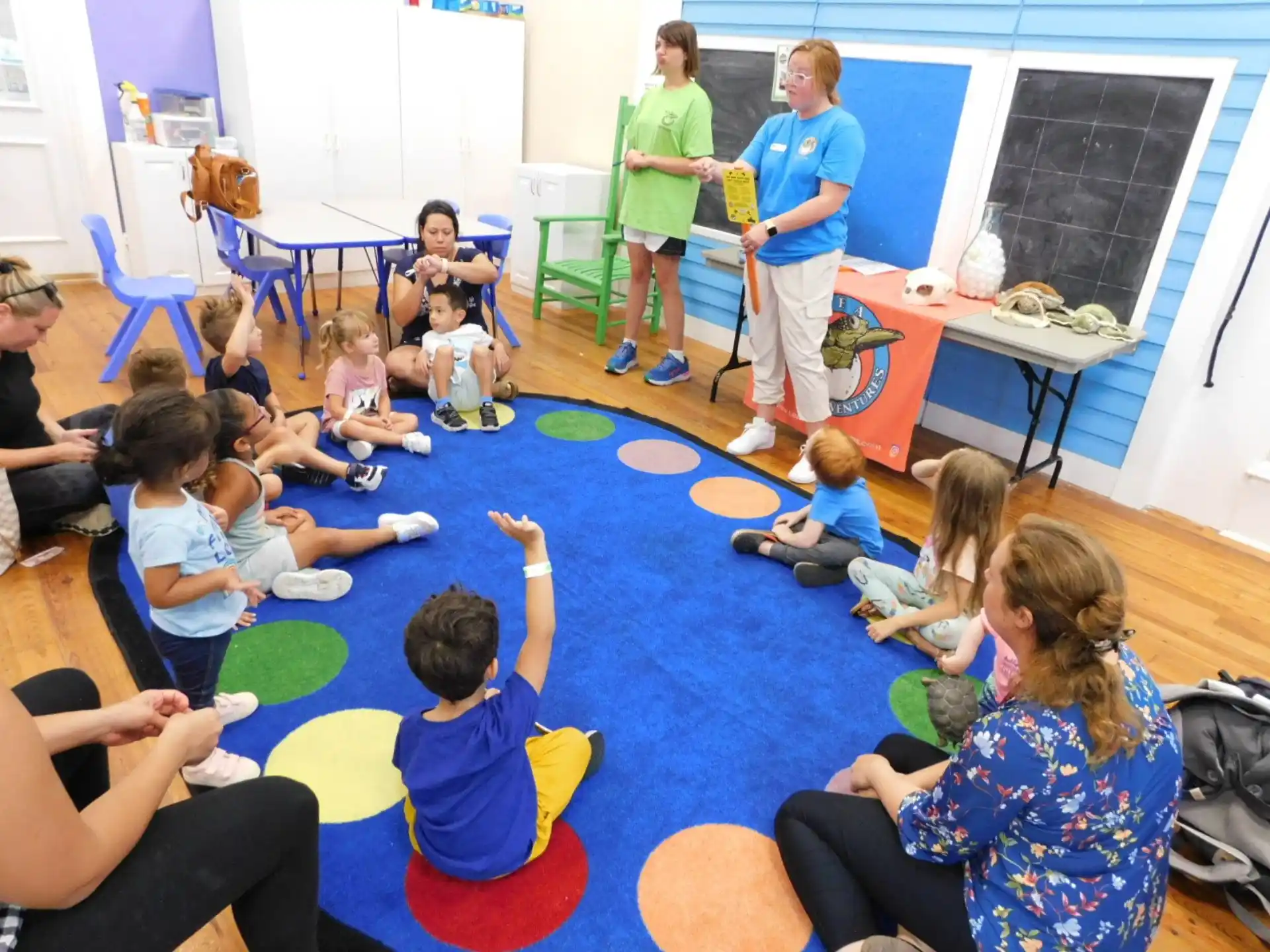 a group of people sitting on the floor in a room
