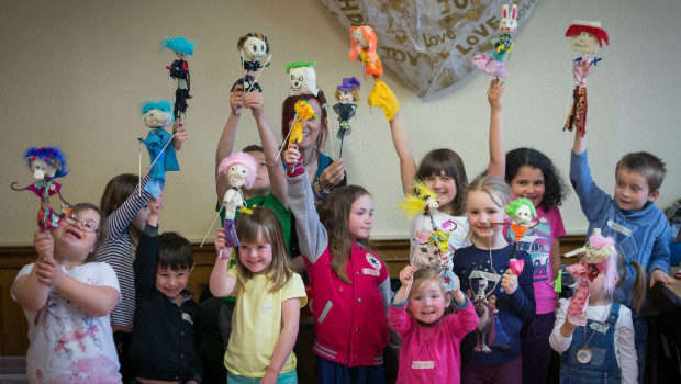 a group of children holding toys
