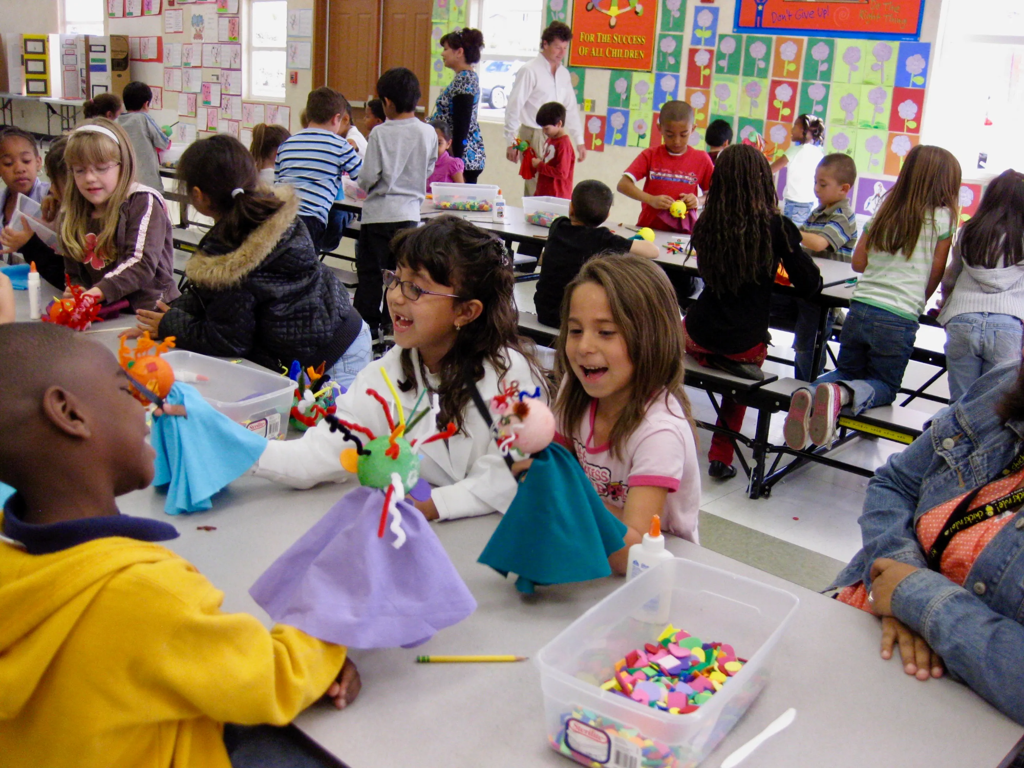 a group of children sitting at a table