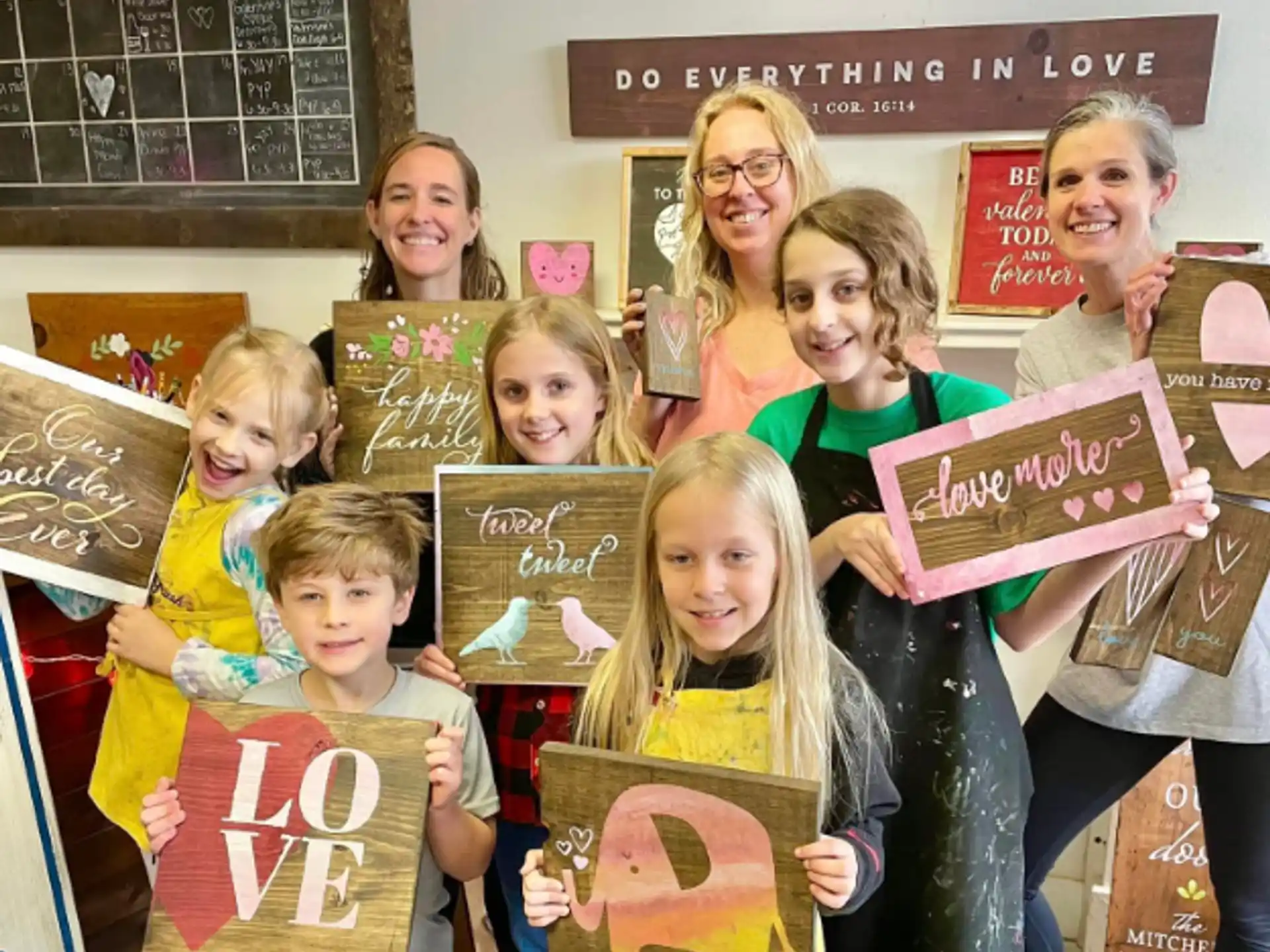 a group of children holding signs