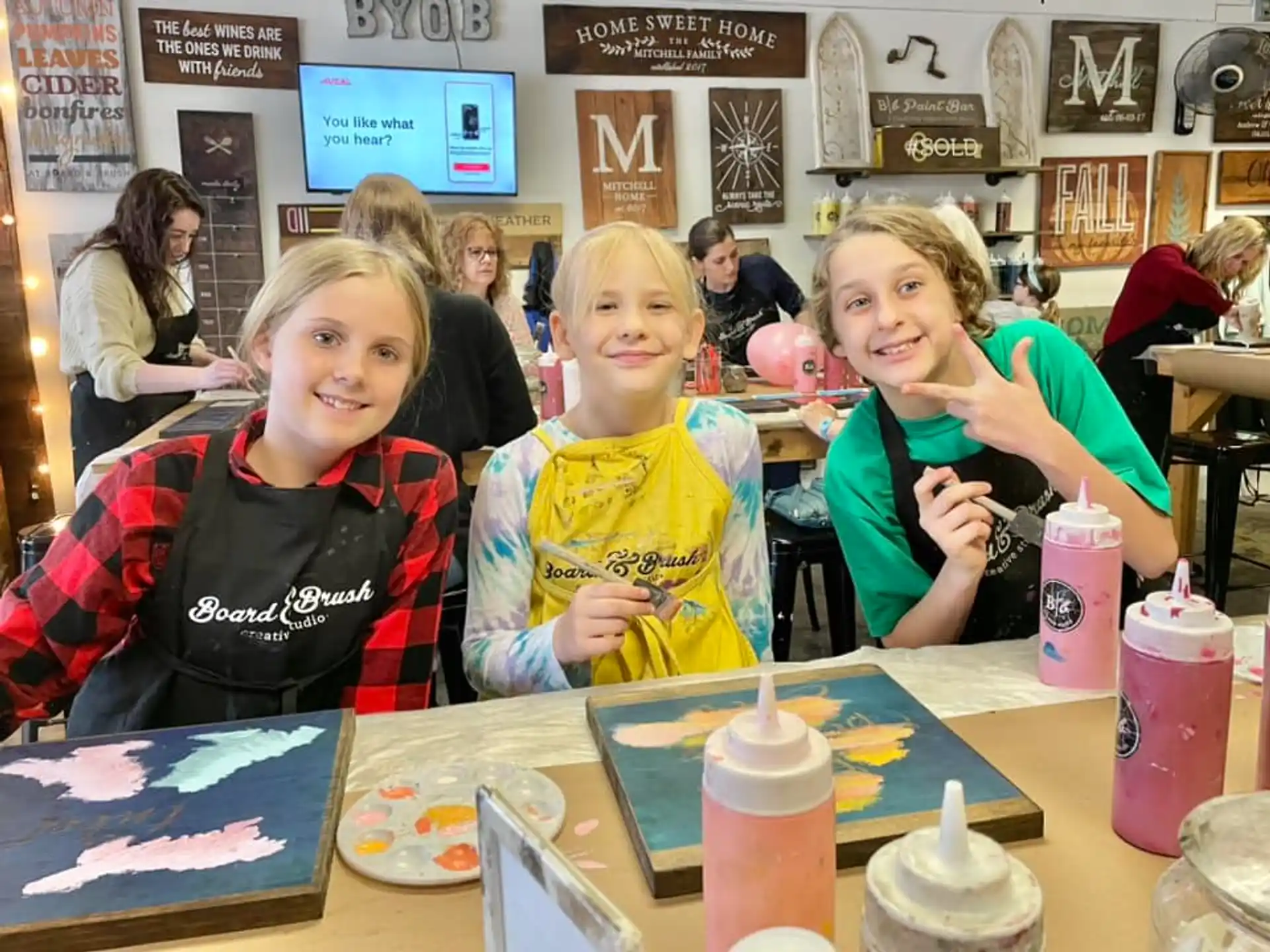 a group of girls sitting at a table