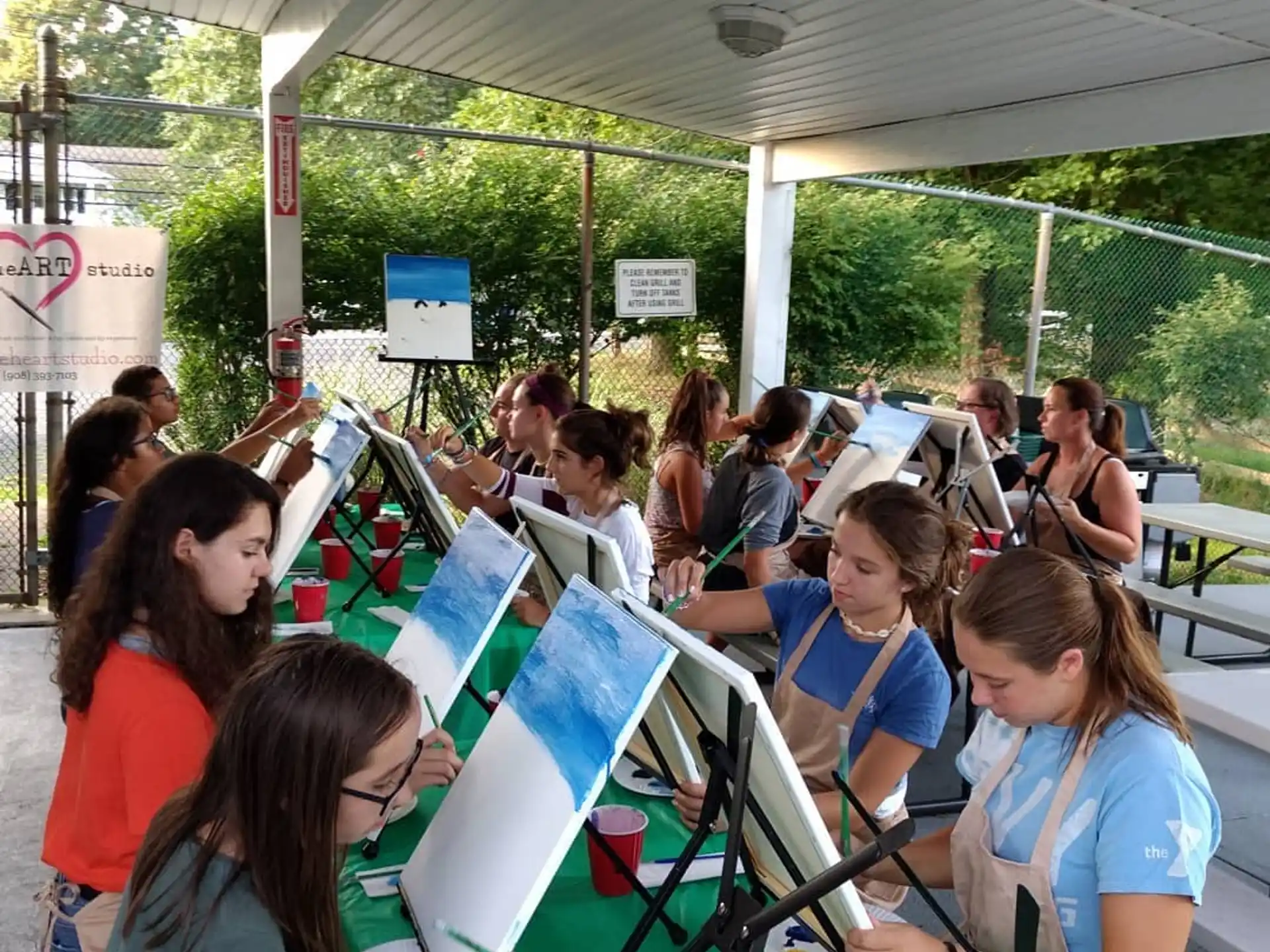 a group of people painting