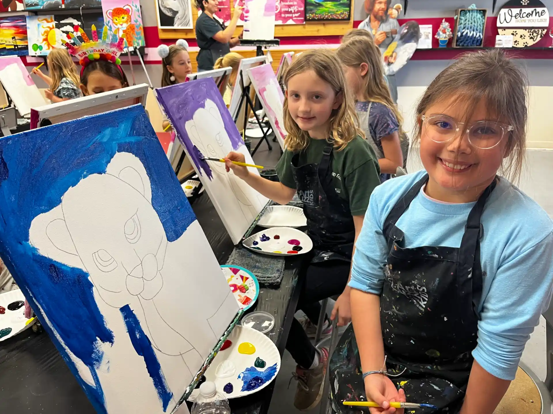 a person and a couple of girls holding a drawing