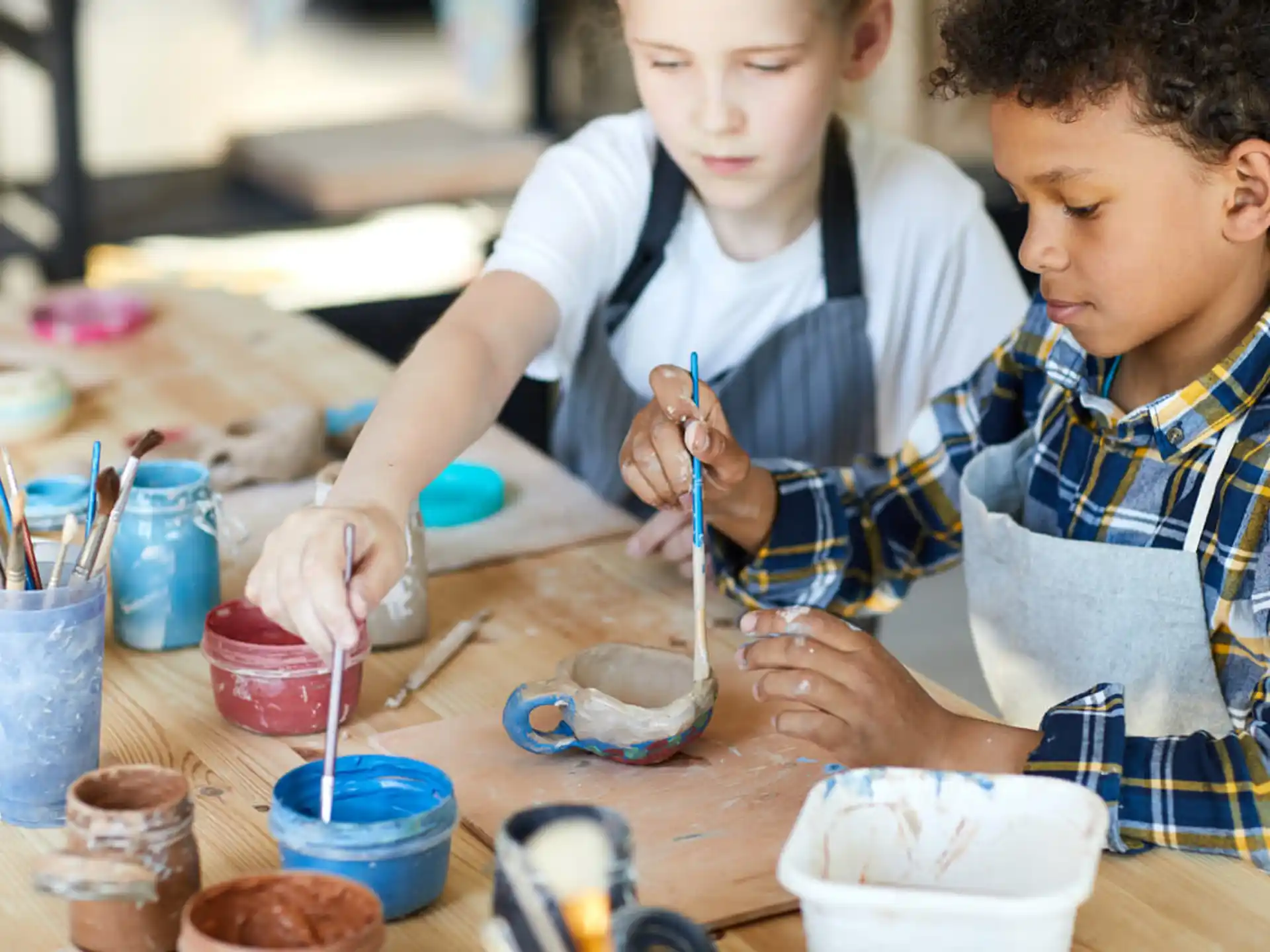 medium shot of kids painting