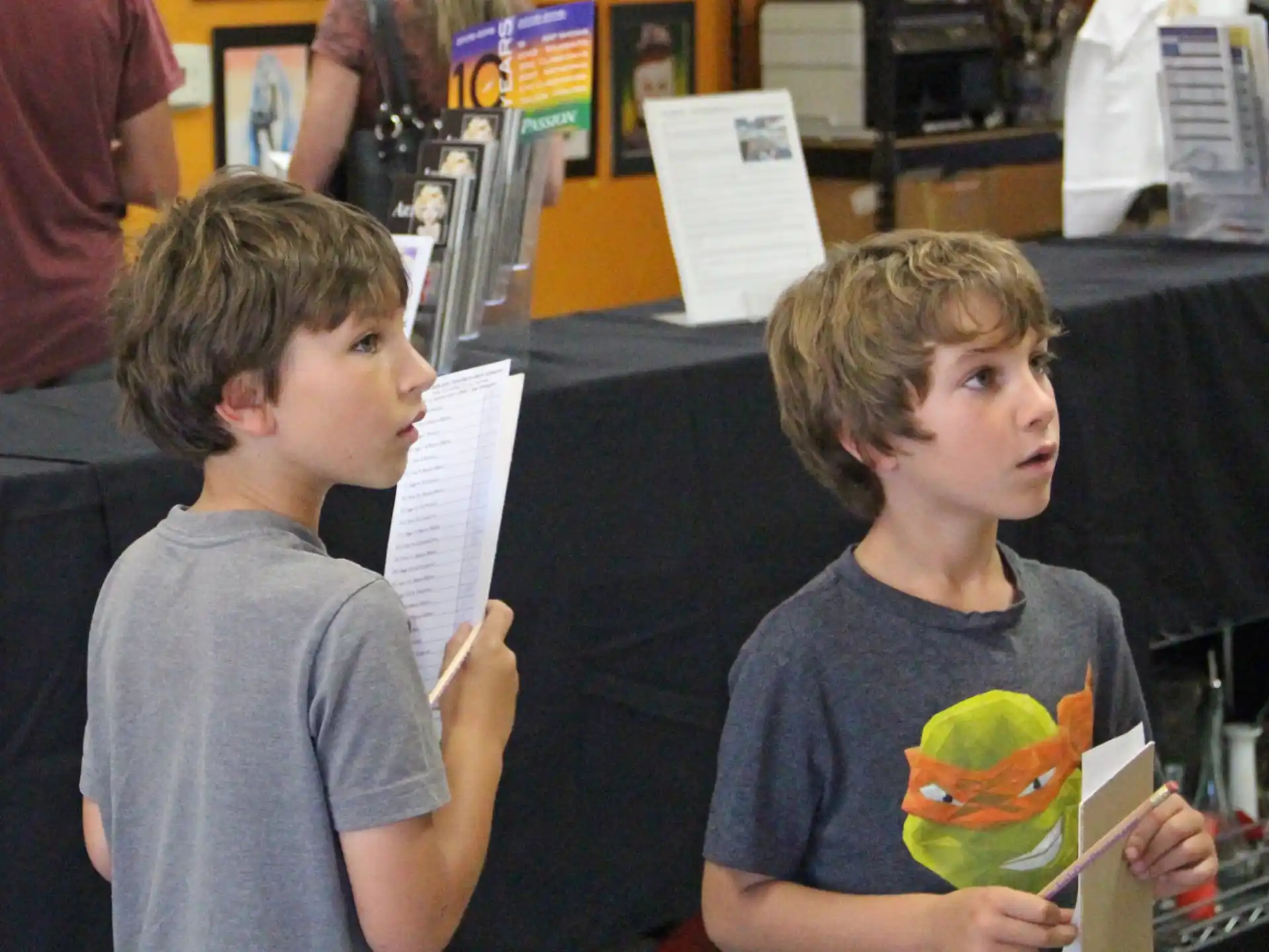 a couple of boys holding books