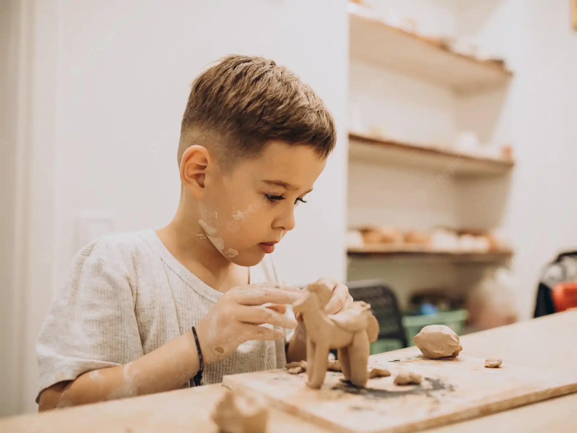 a young boy eating a cookie