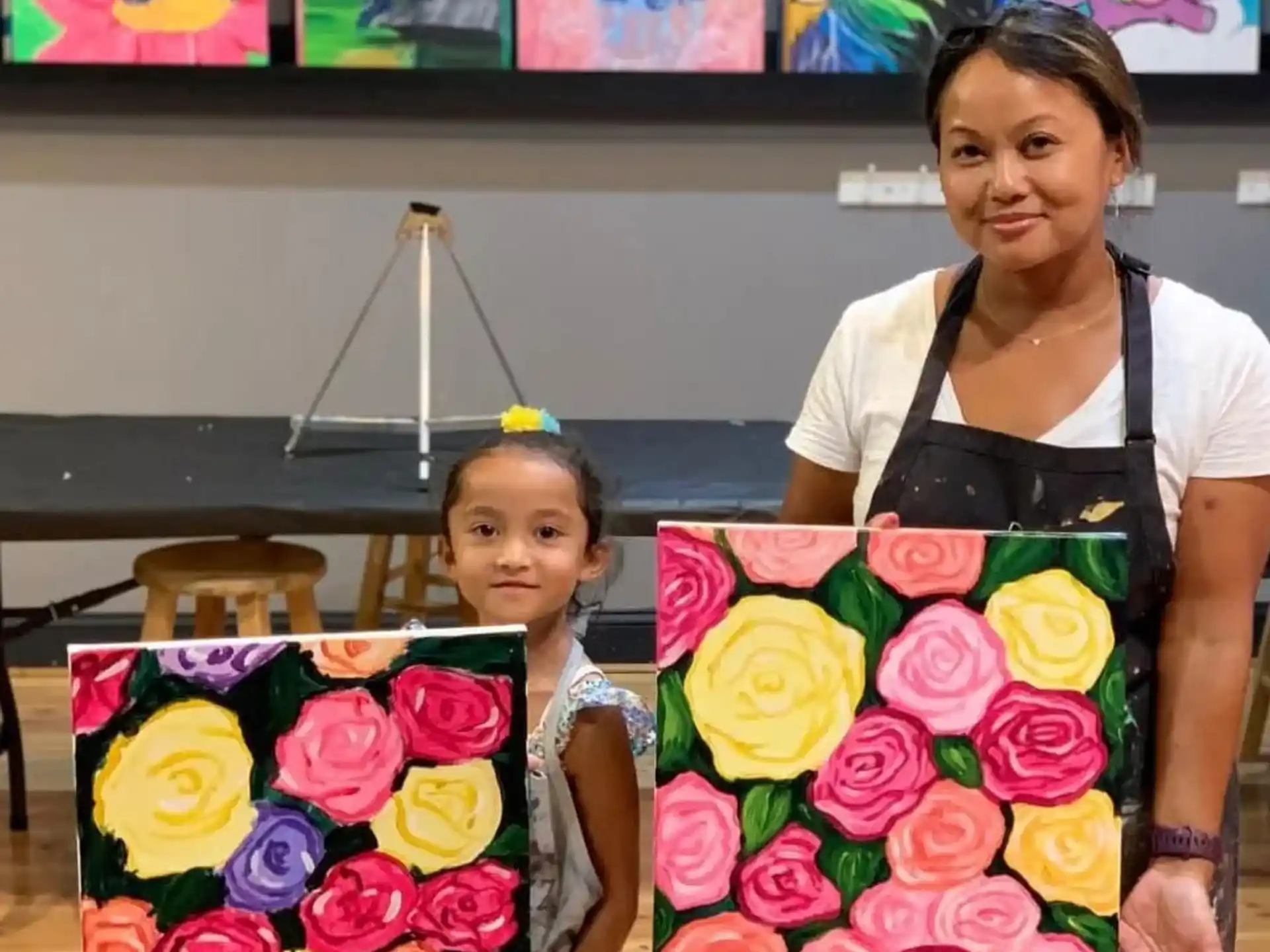 a person and a child holding flowers