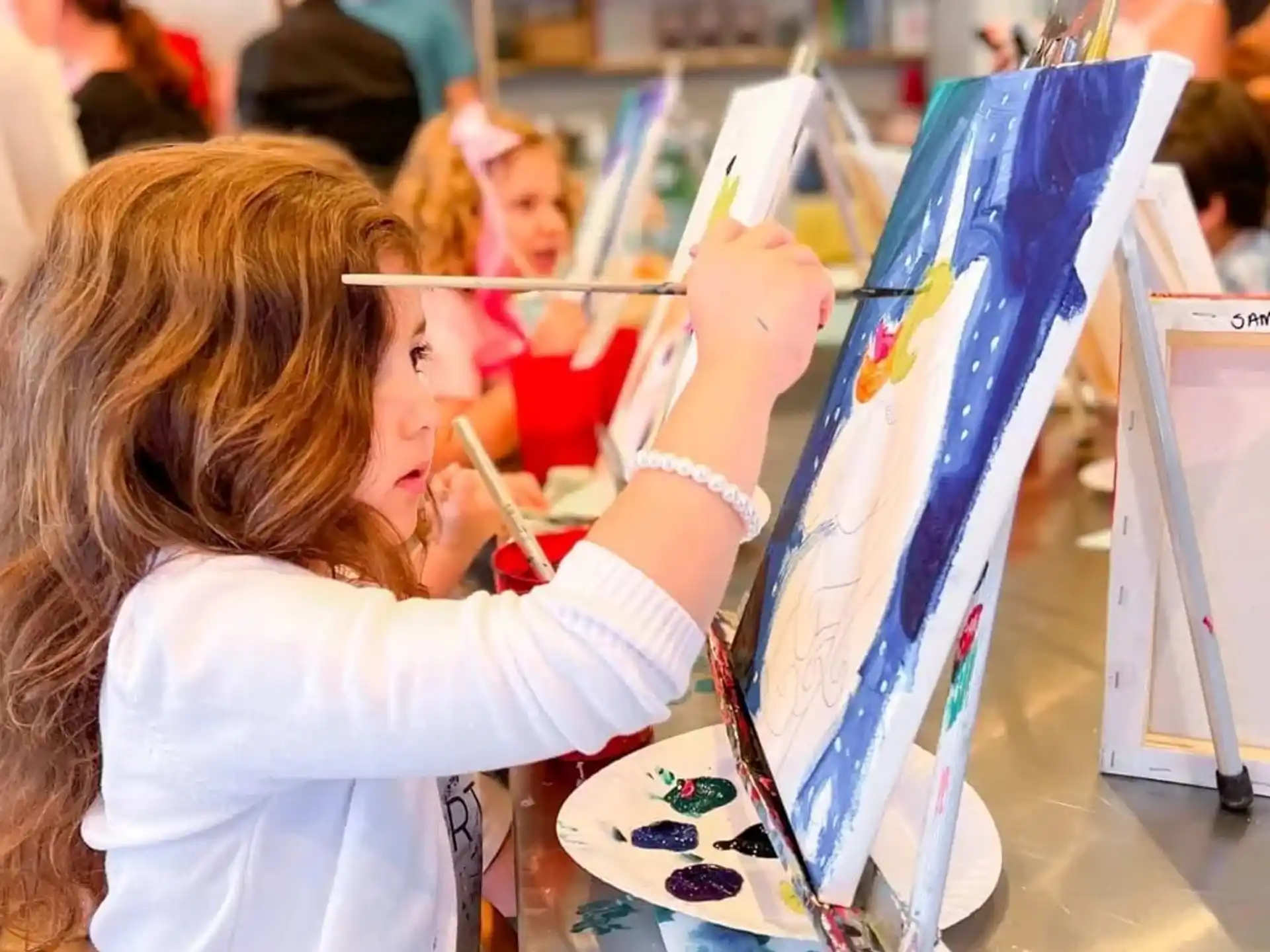 a young girl painting