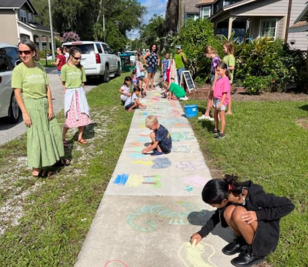 a group of people playing in a yard