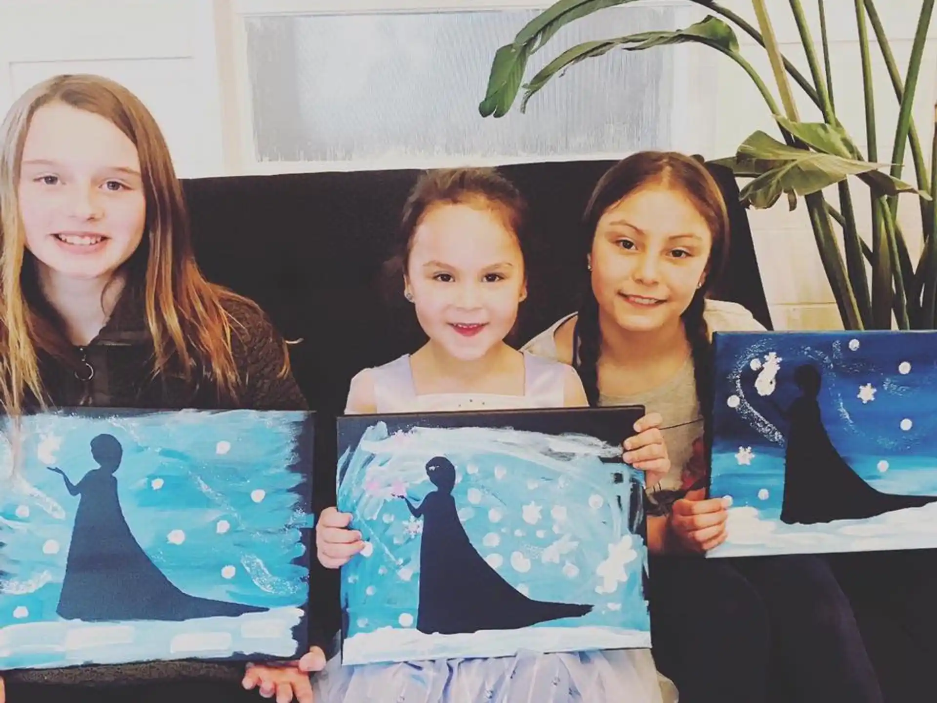 a group of girls holding a picture