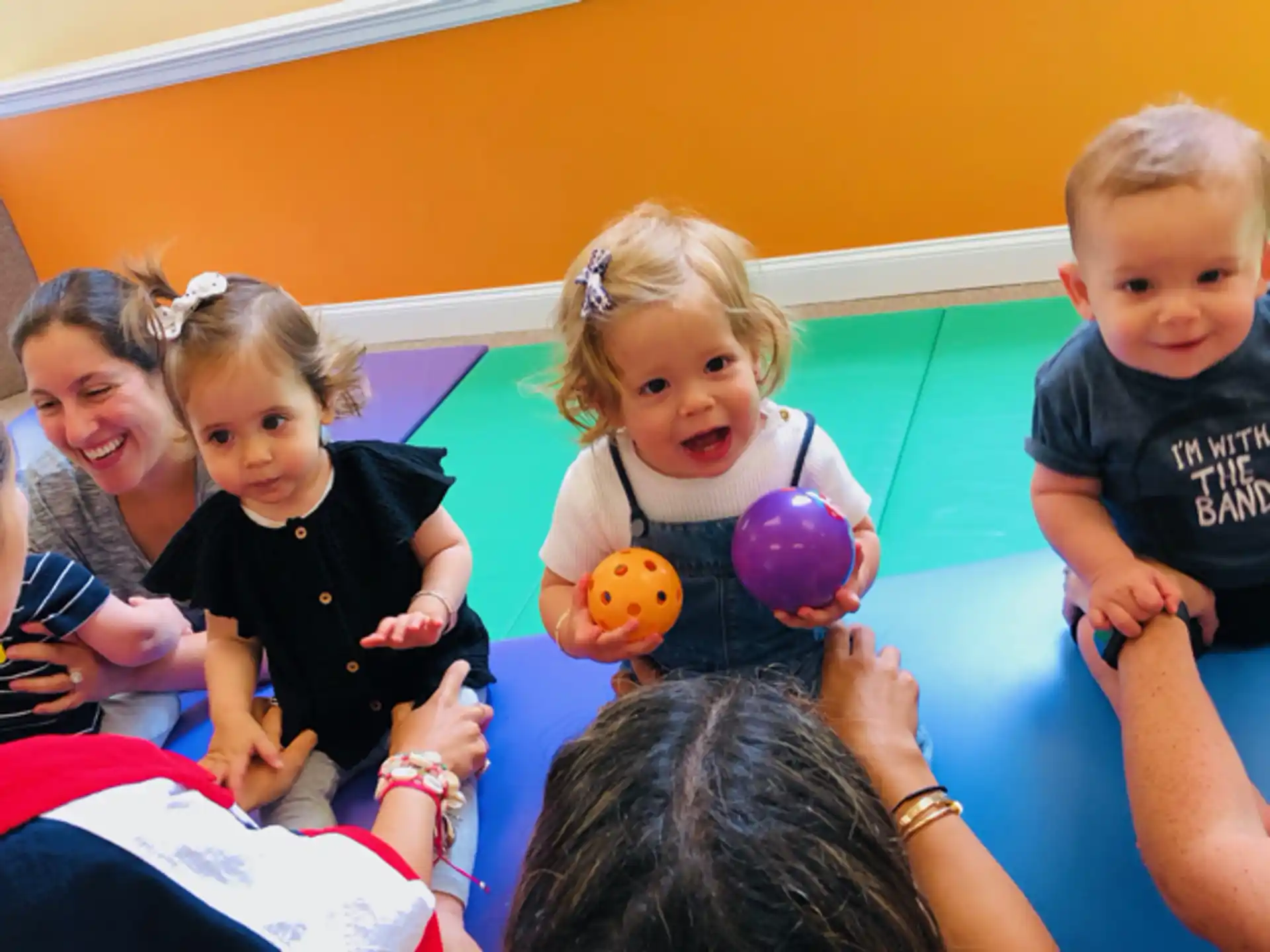 a group of children playing with balls