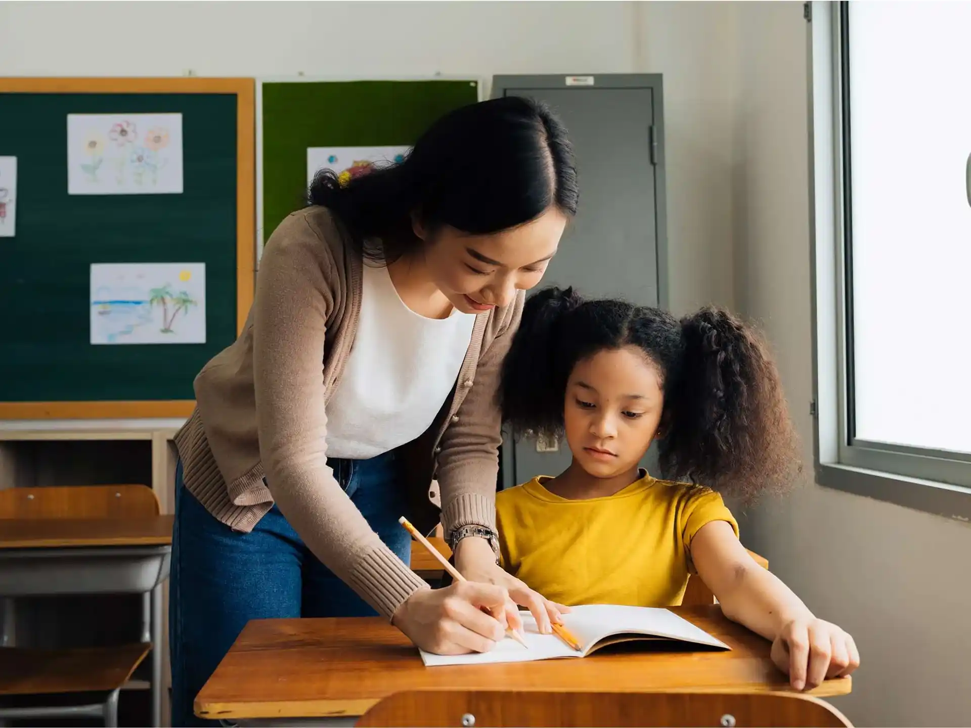 a woman and a child in a classroom