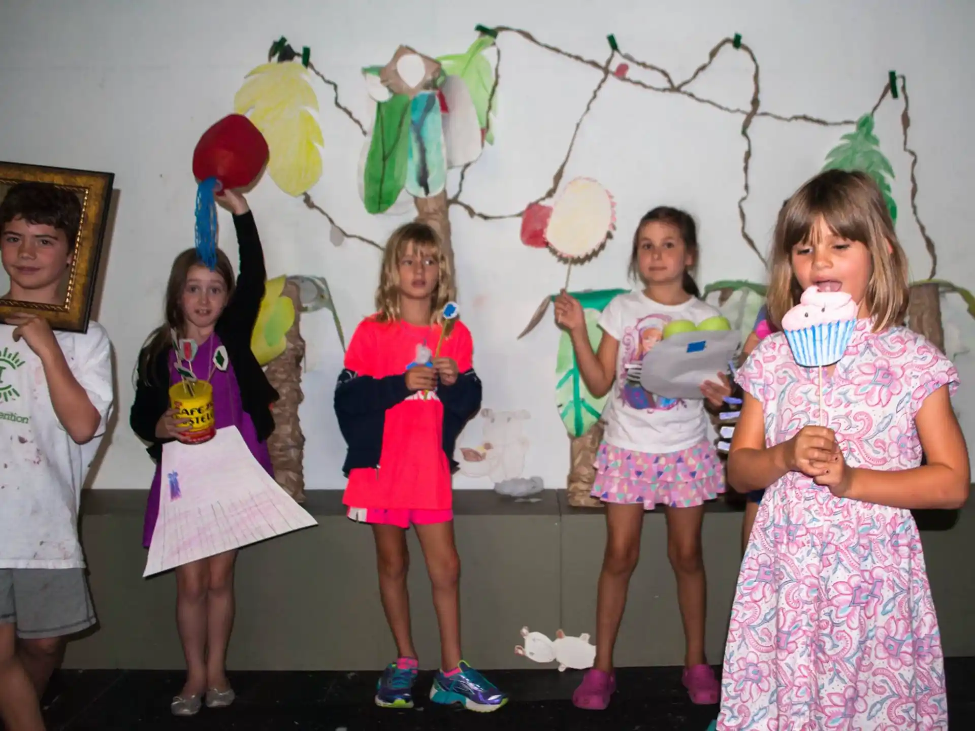 a group of children holding balloons