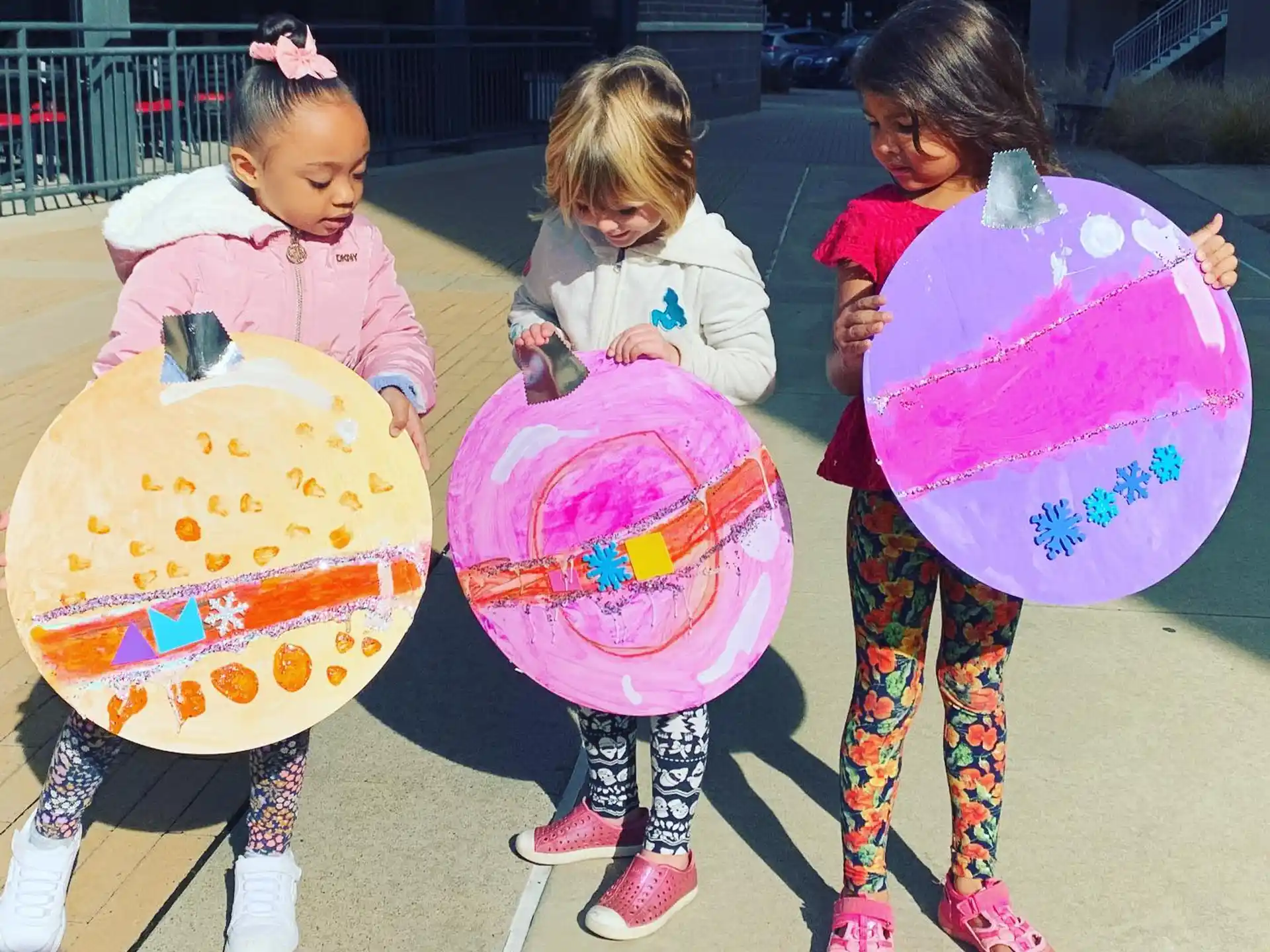 a group of children holding large bags