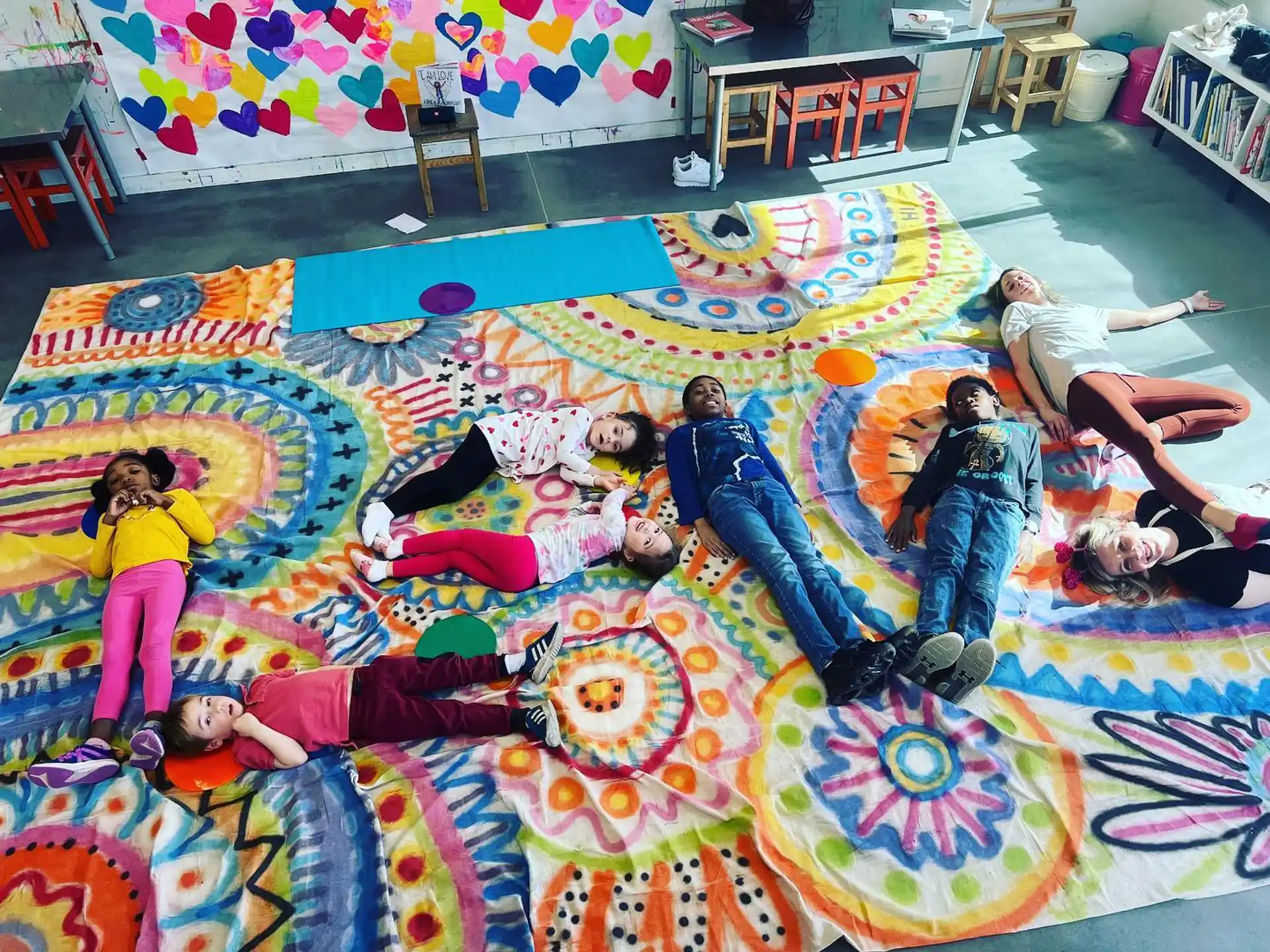 a group of people on a colorful rug