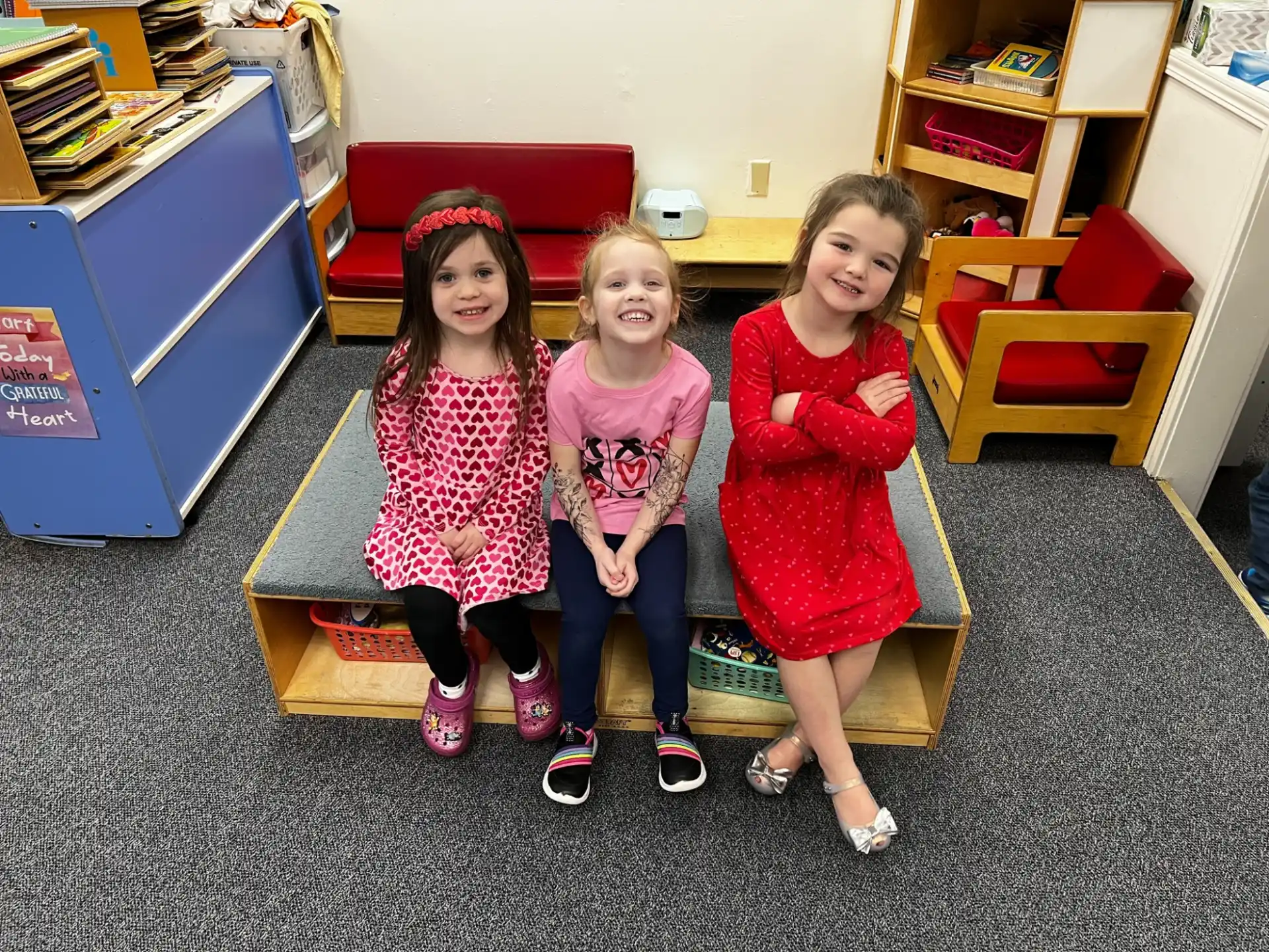 a group of girls sitting on the floor