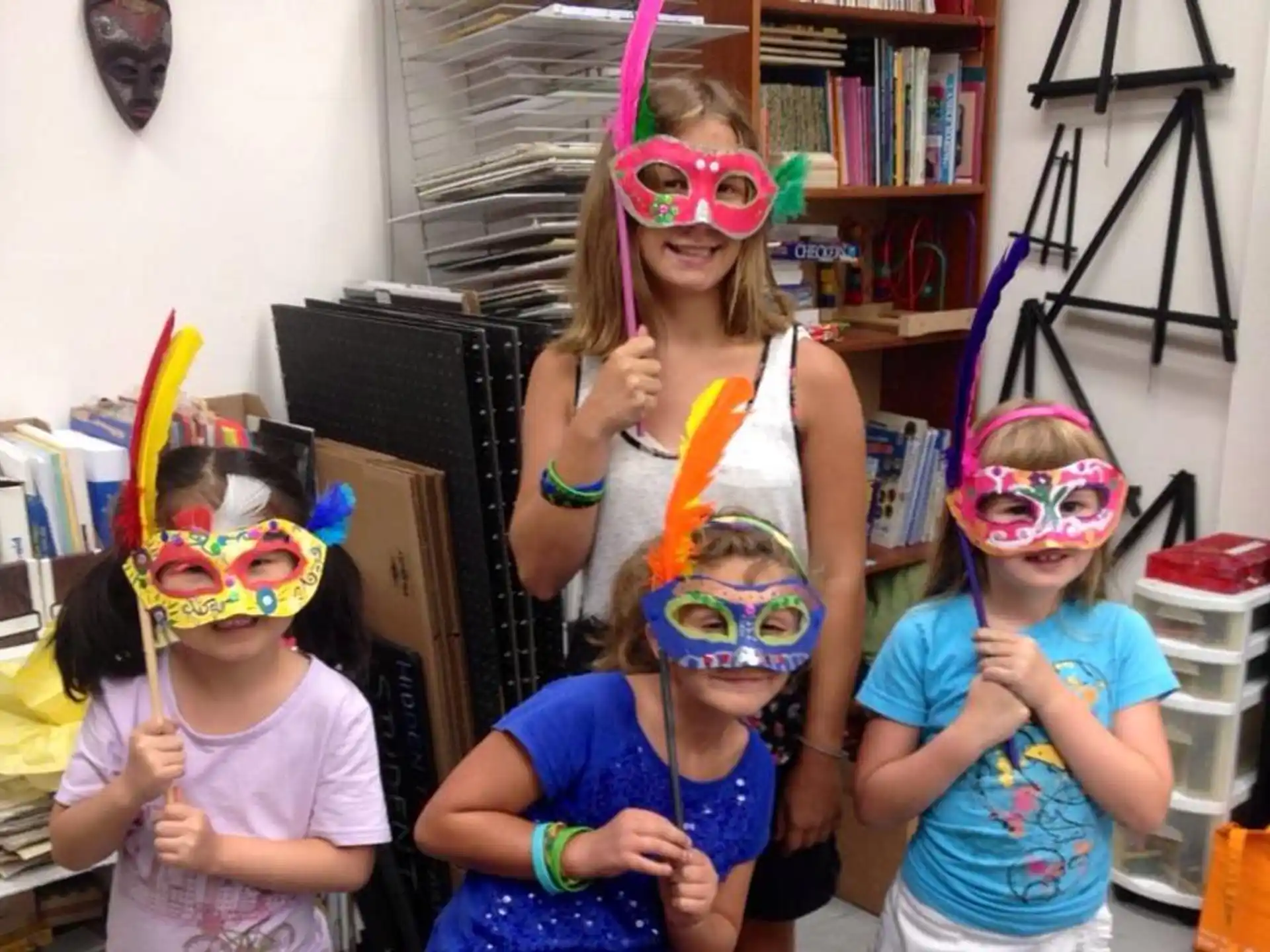 a group of children wearing masks