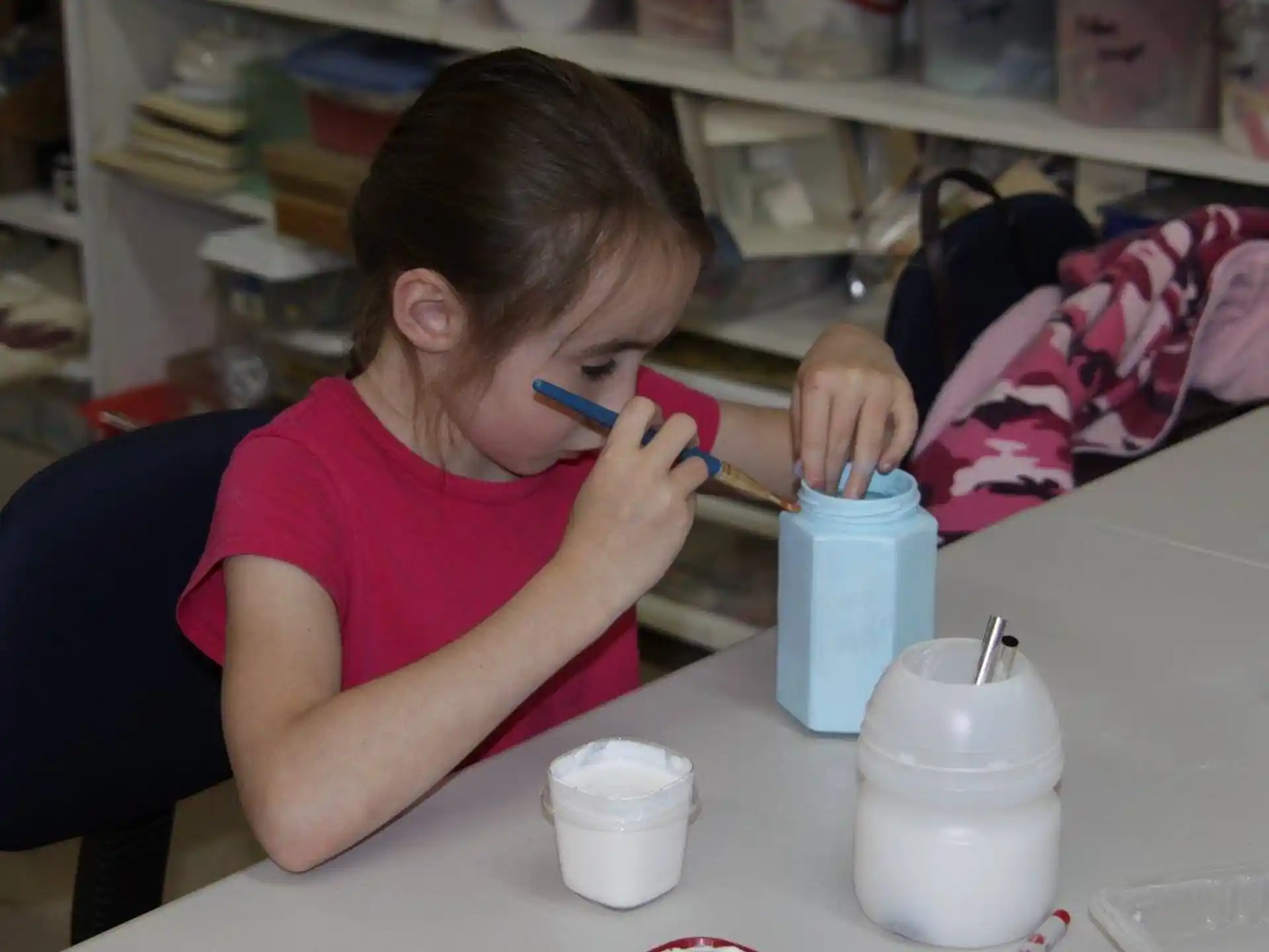 a young girl painting