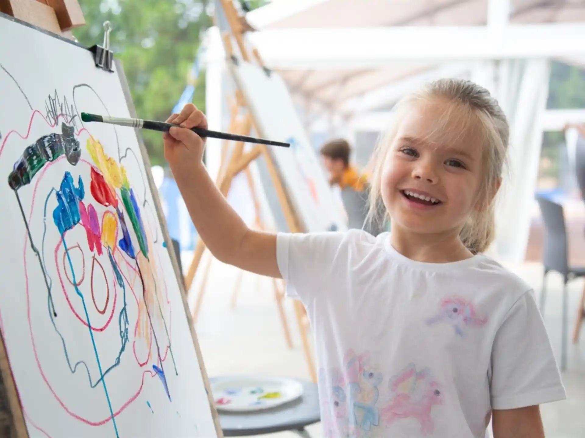 a young girl painting