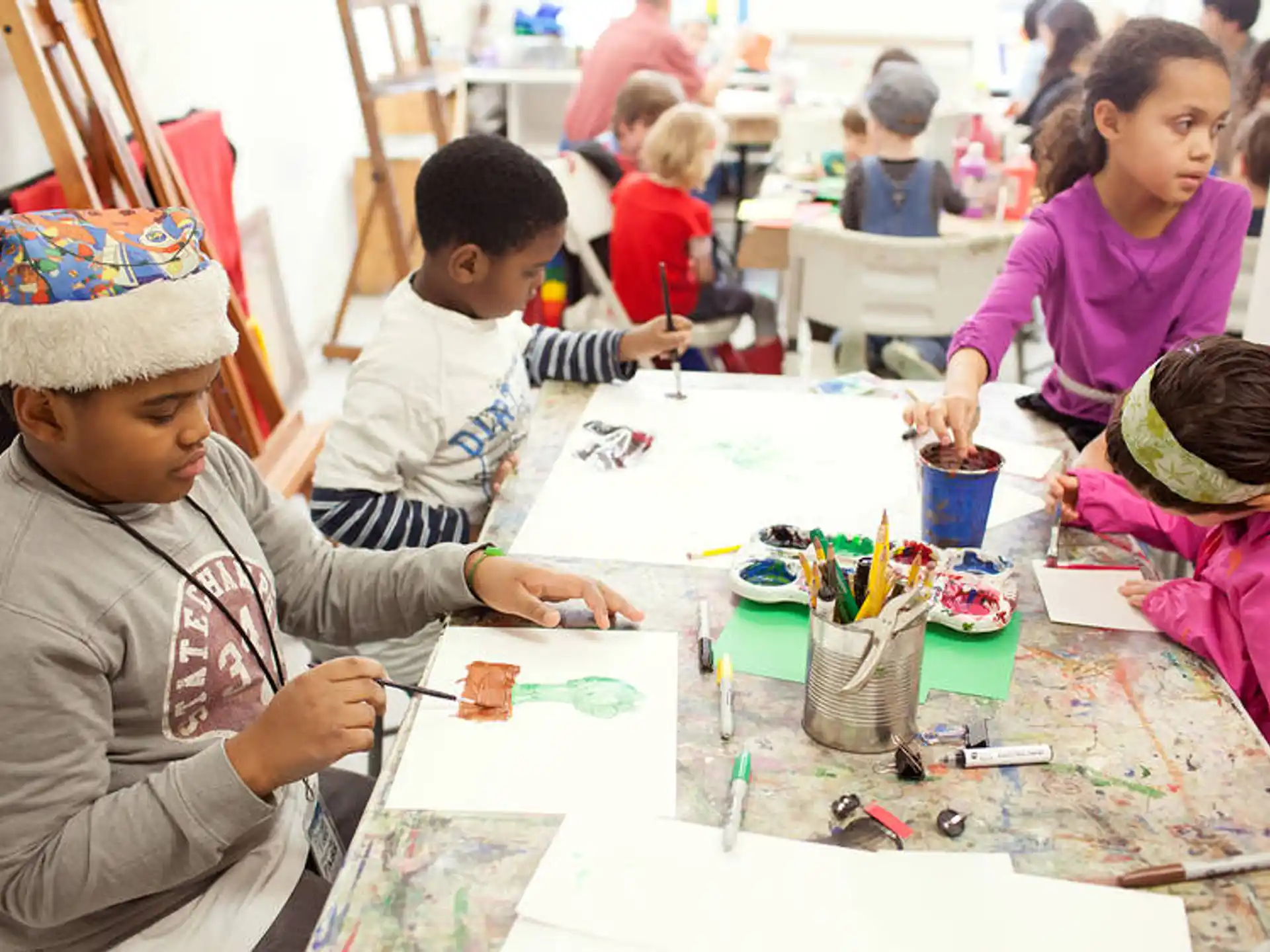 a group of children painting