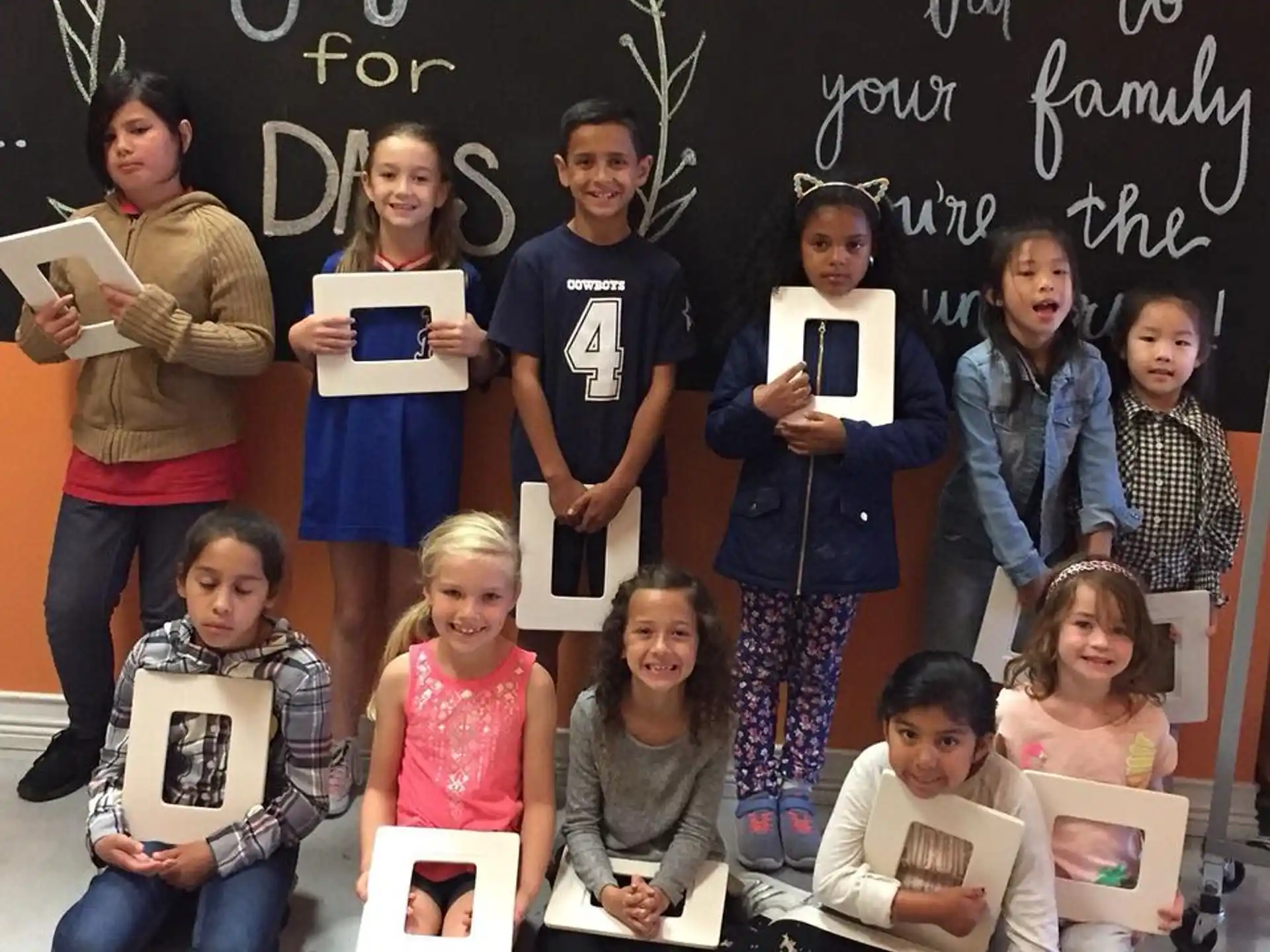 a group of children posing for a photo
