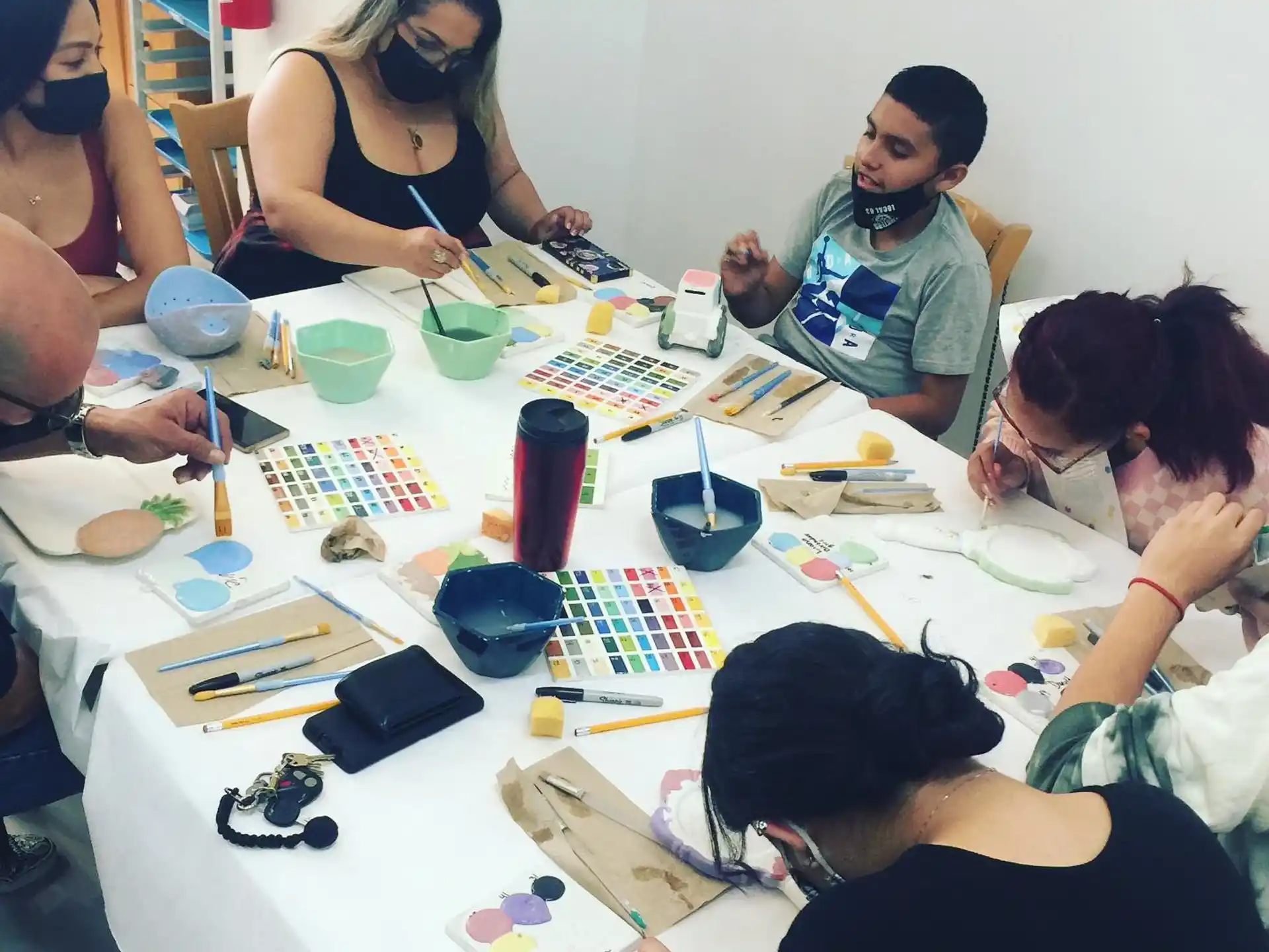 a group of people sitting around a table with a board game