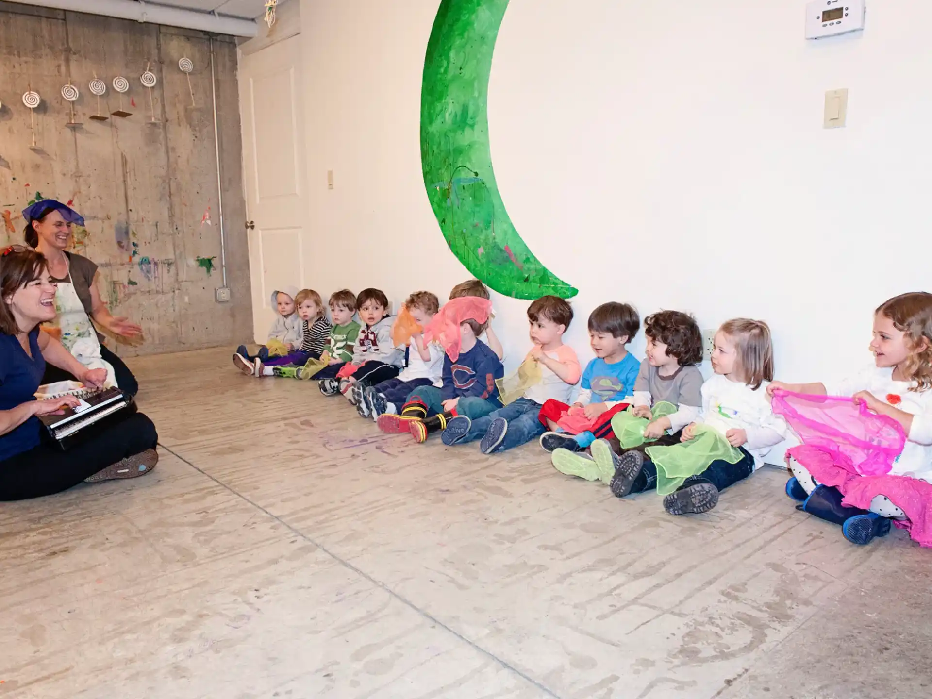a group of children sitting on the floor