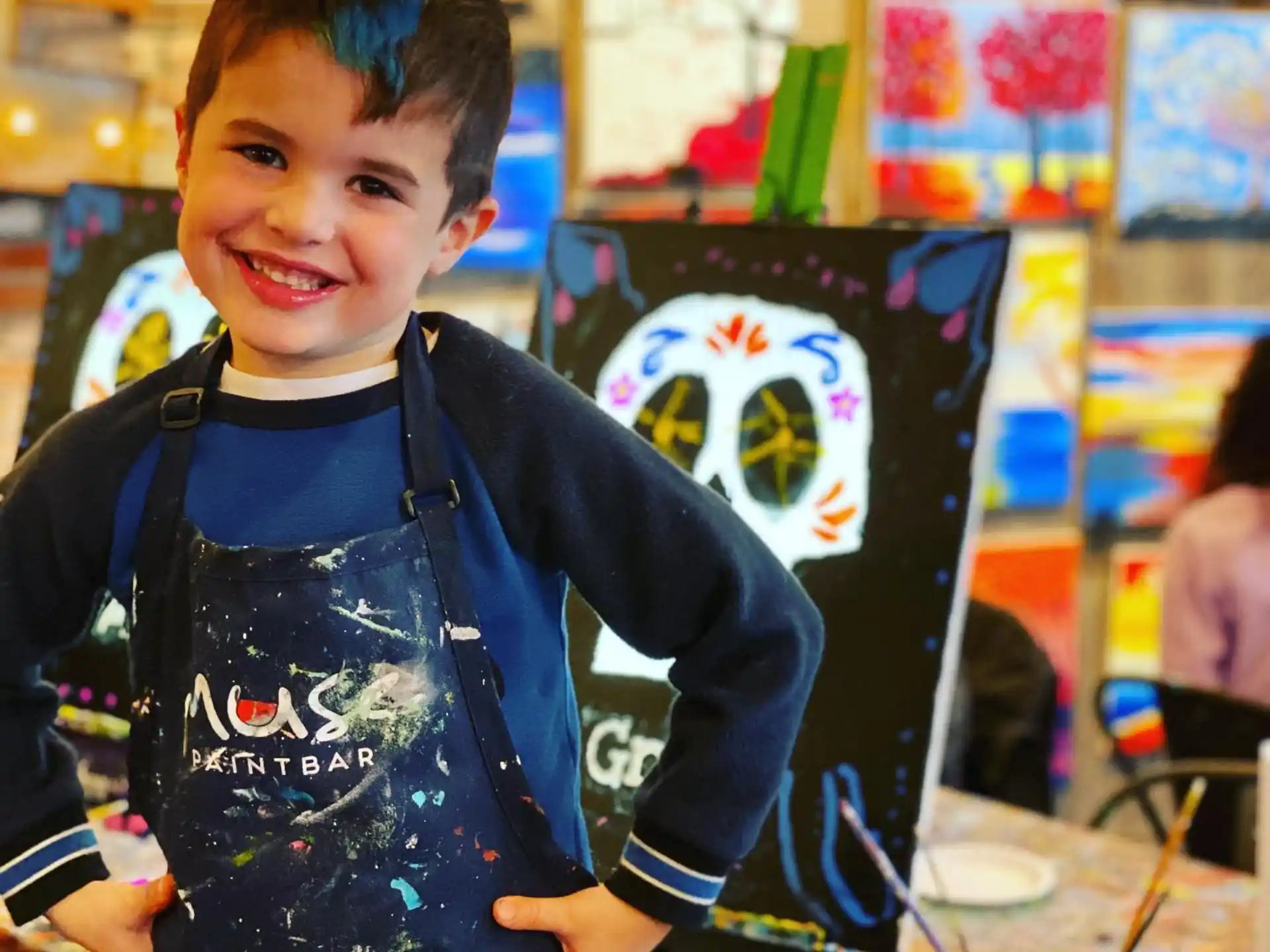 a boy holding a drawing