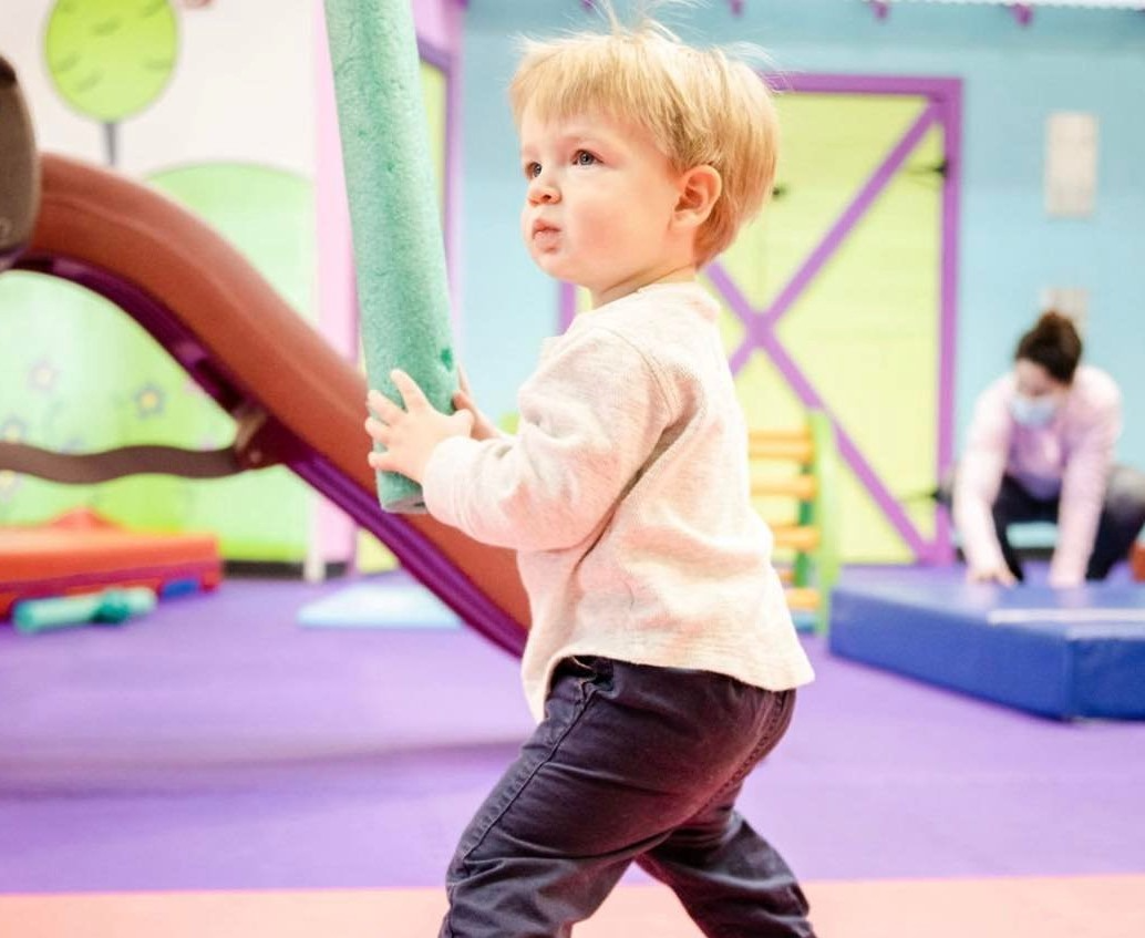 a young boy playing on a playground