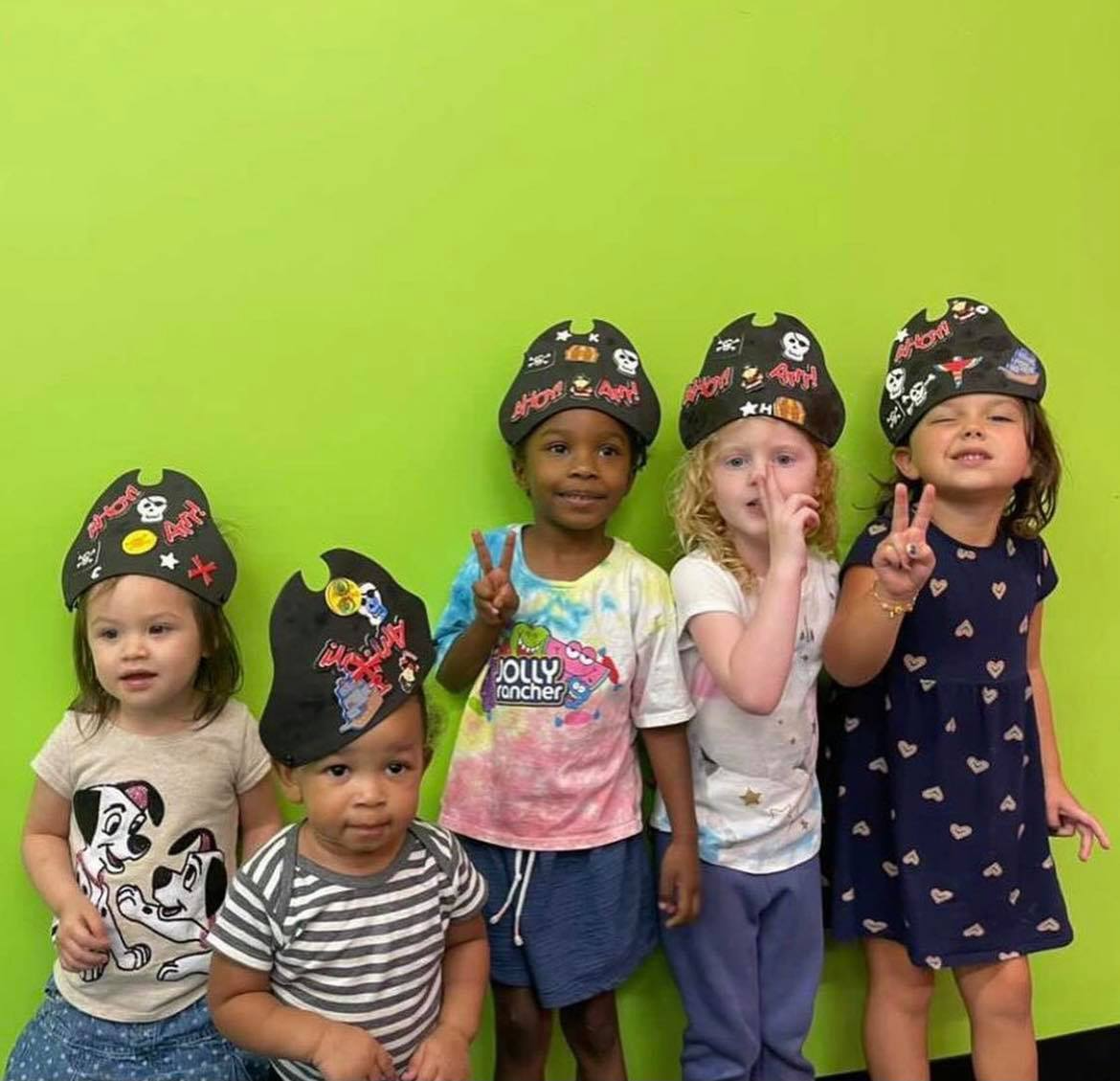 a group of children wearing hats