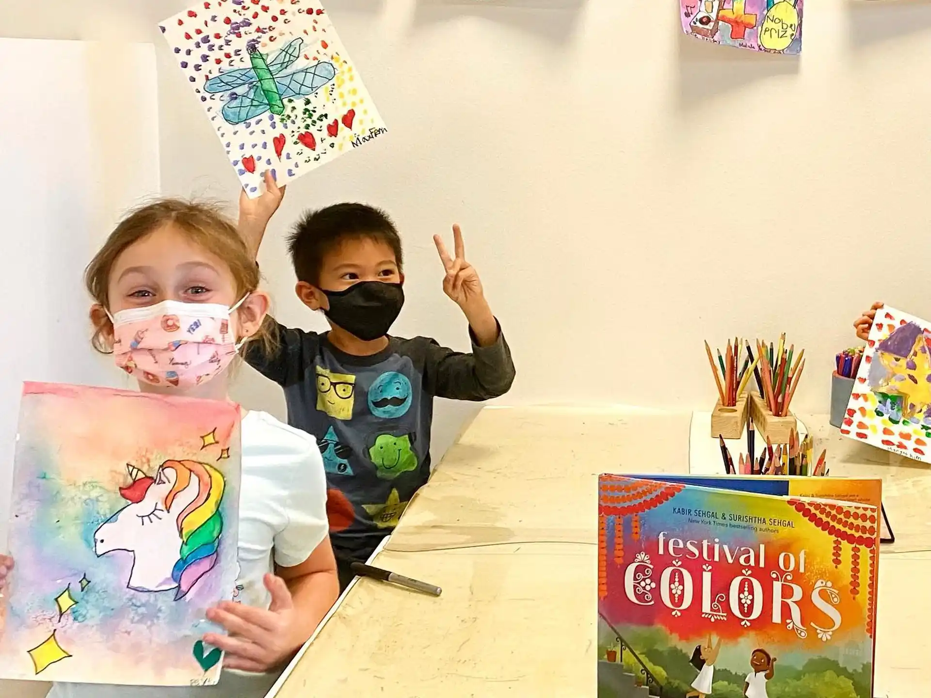a couple of kids wearing masks