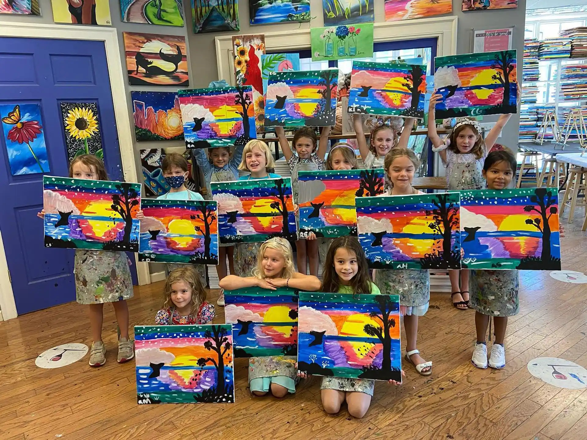 a group of children holding colorful flags