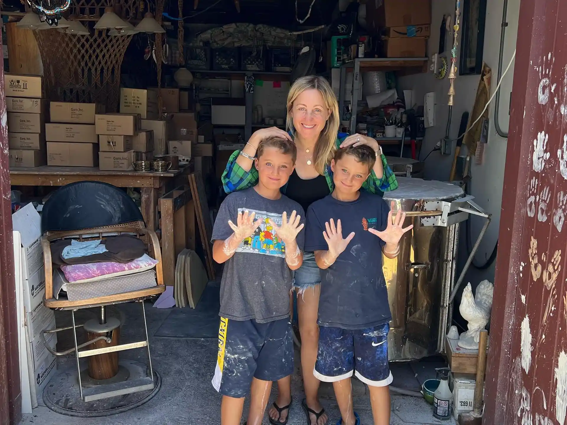 a group of kids standing in front of a storefront