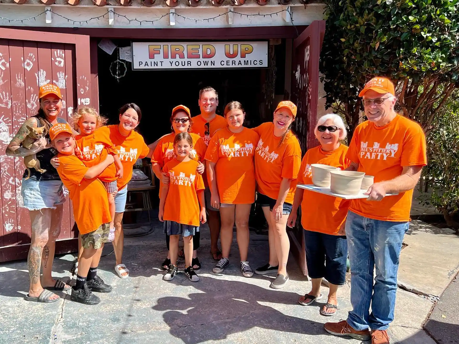 a group of people wearing orange shirts
