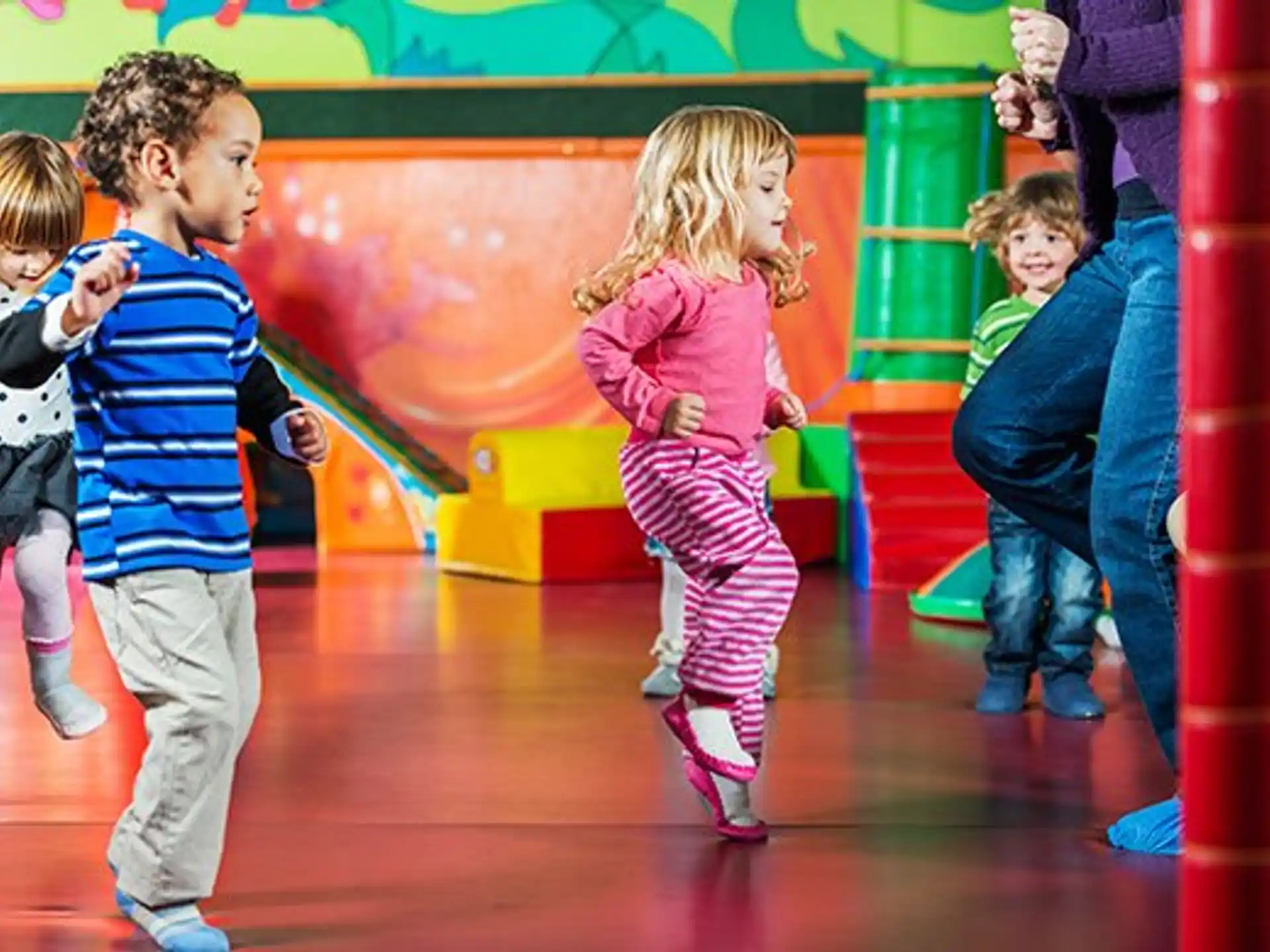 a group of children playing on a playground