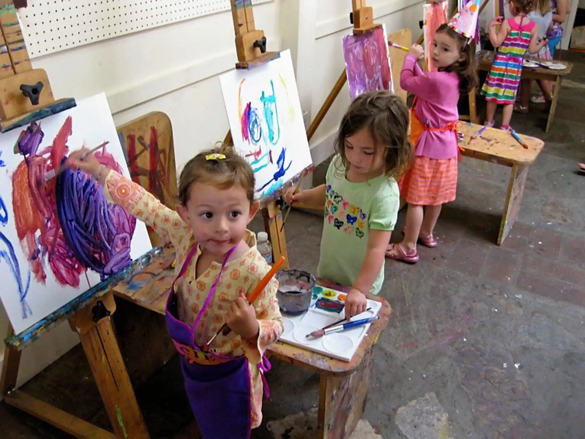 a group of children painting