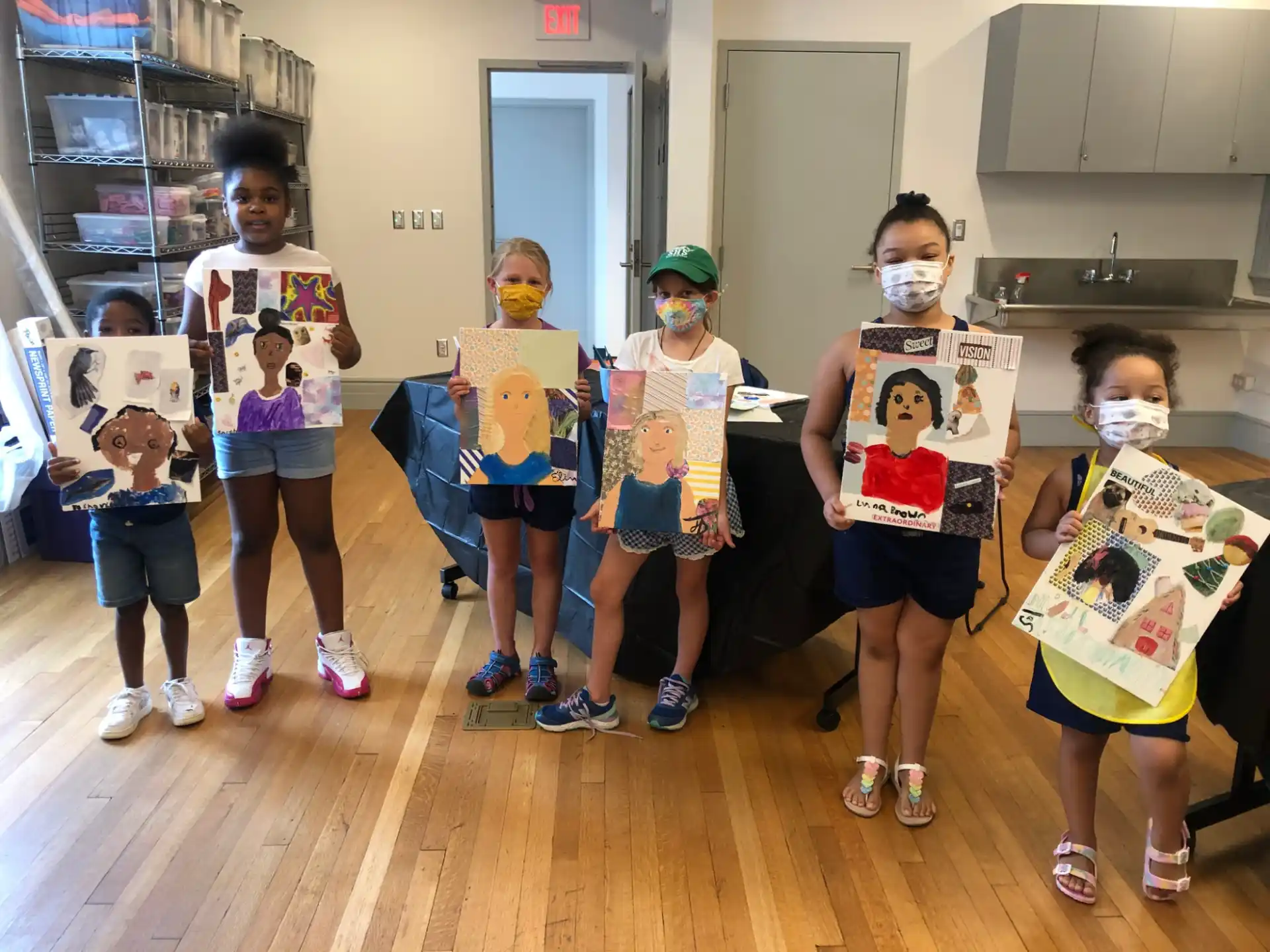 a group of children holding signs