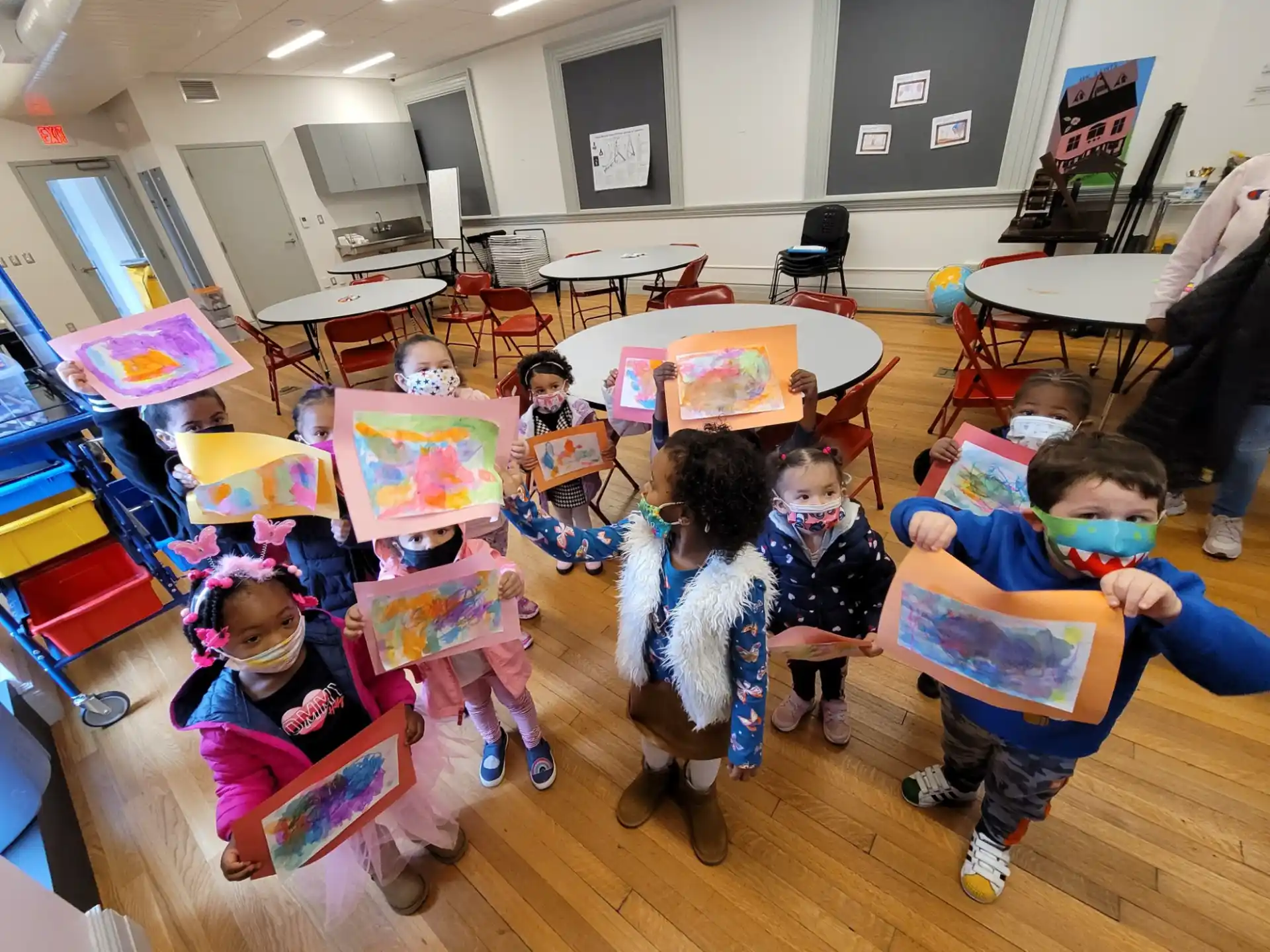 a group of children sitting in a room