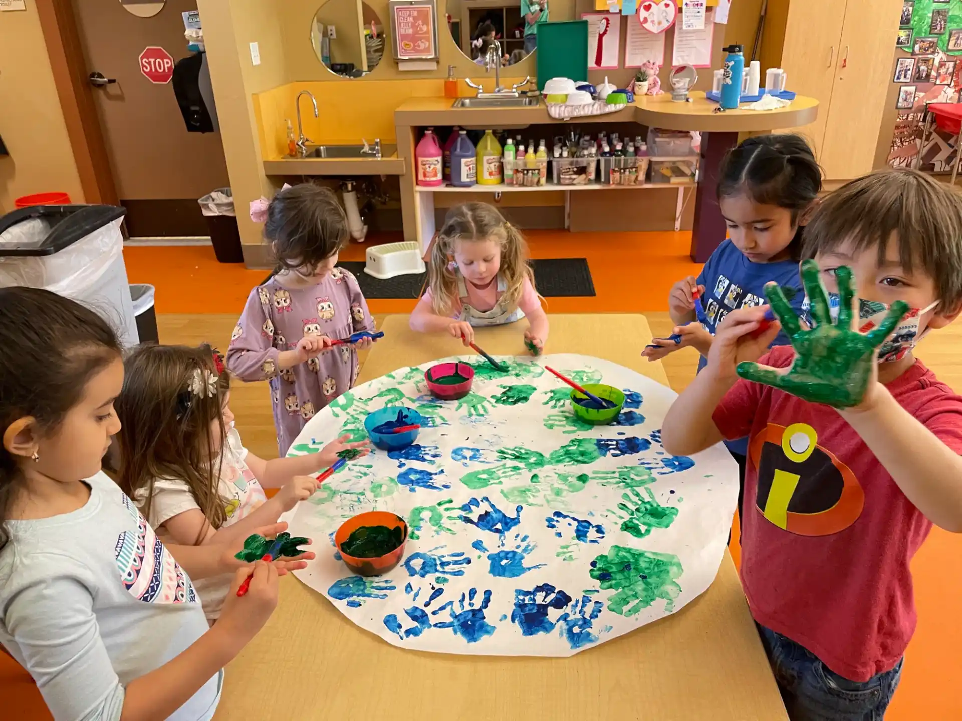 a group of children around a table
