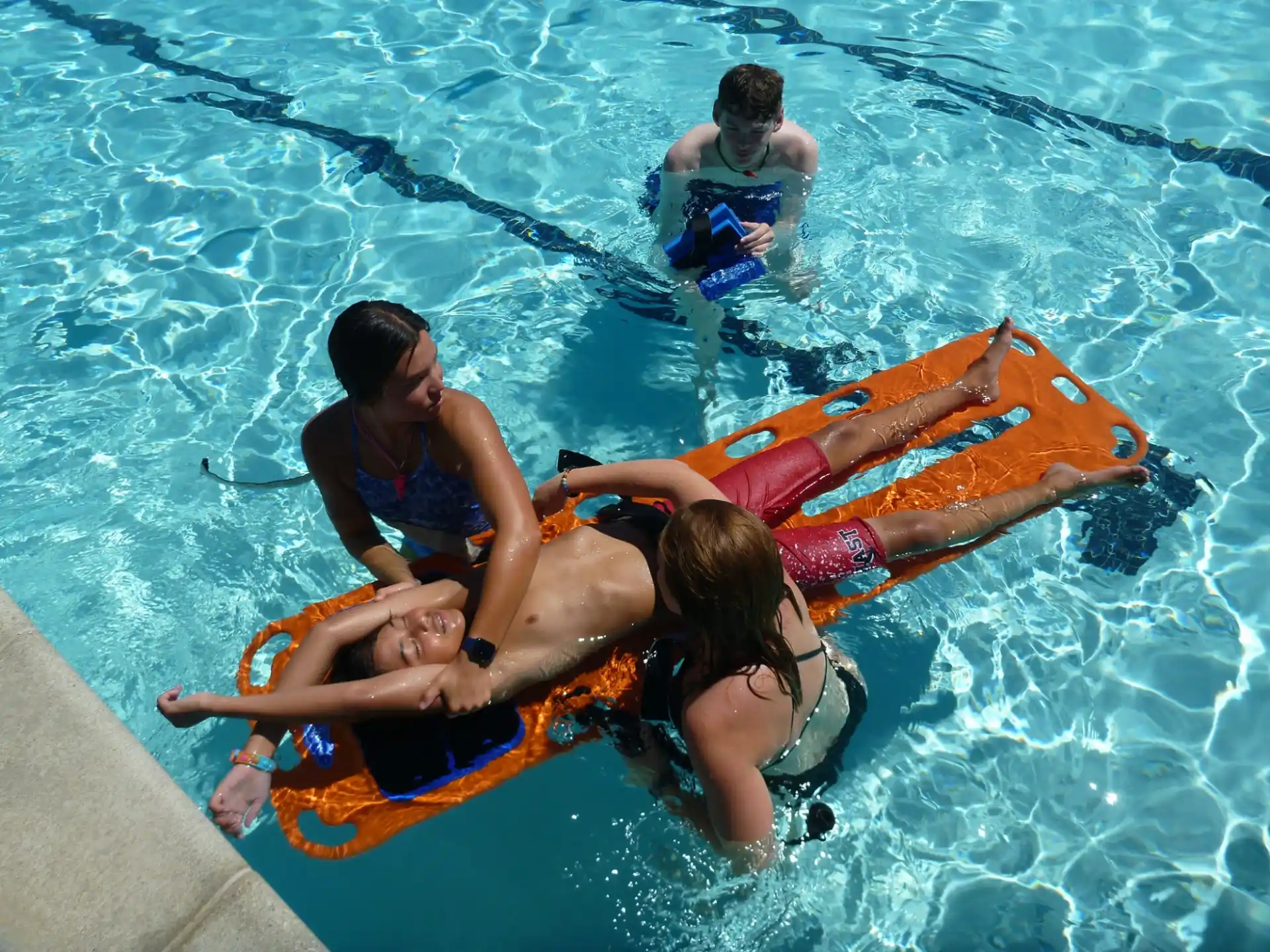 a group of people on a floaty in a pool