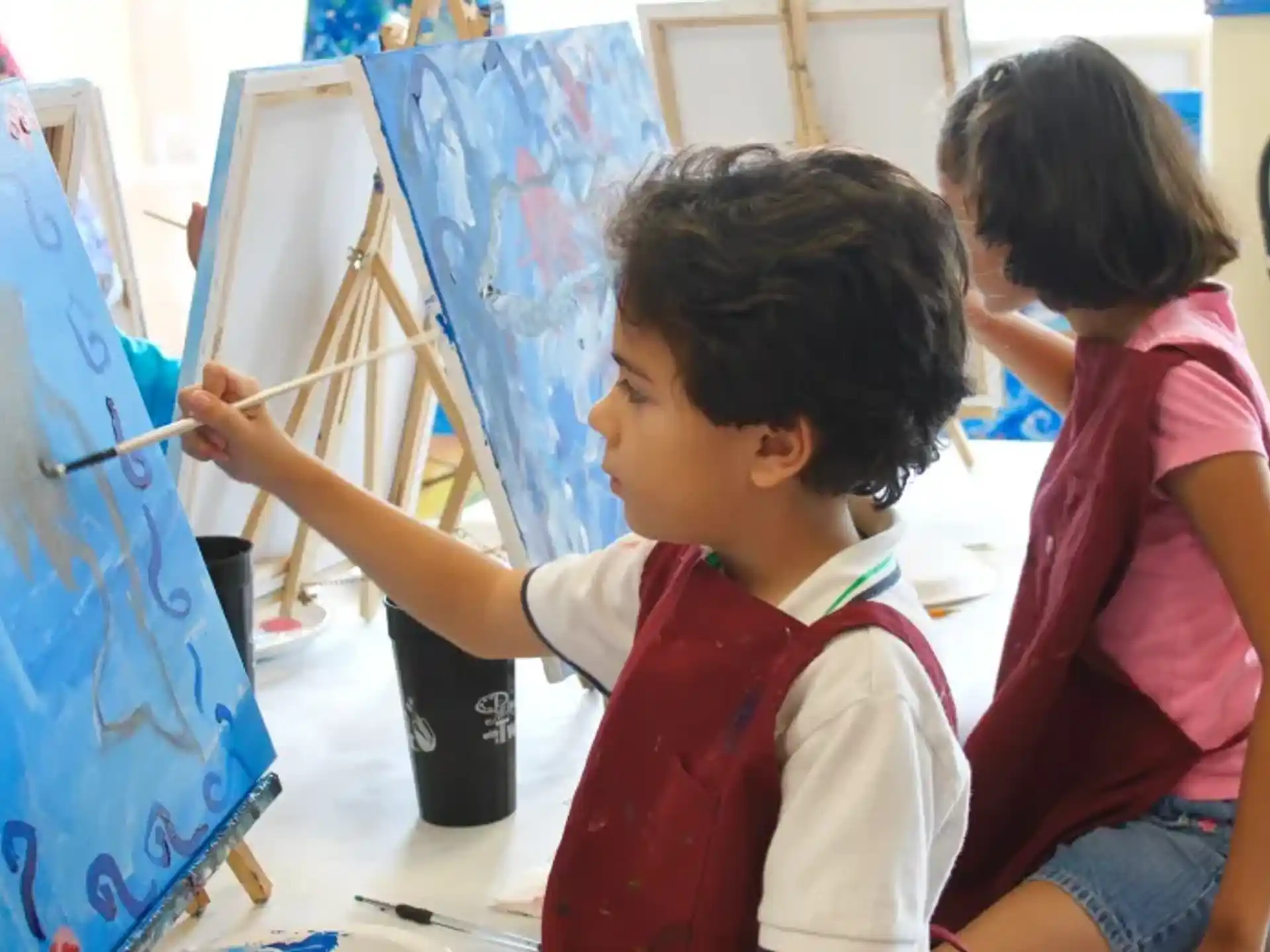 a few young girls painting