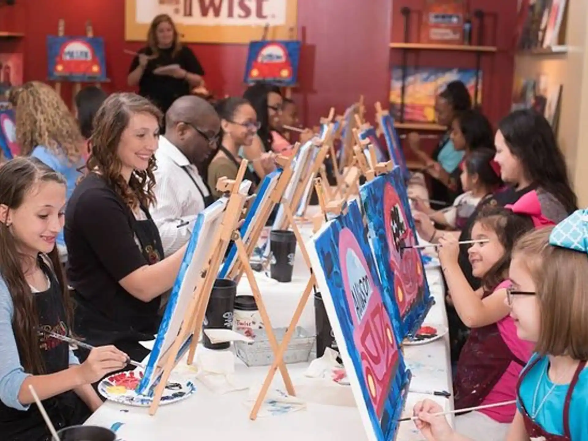 a group of people painting