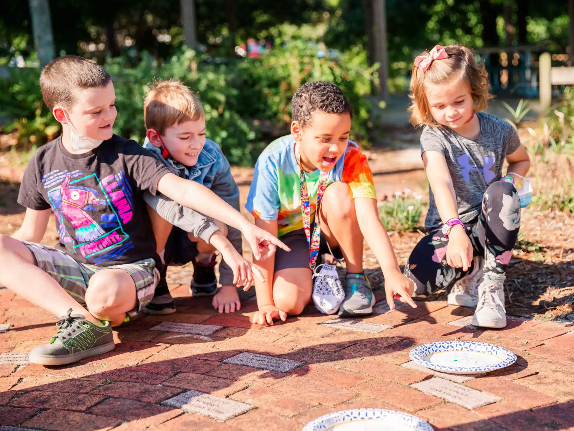 a group of children playing with chalk