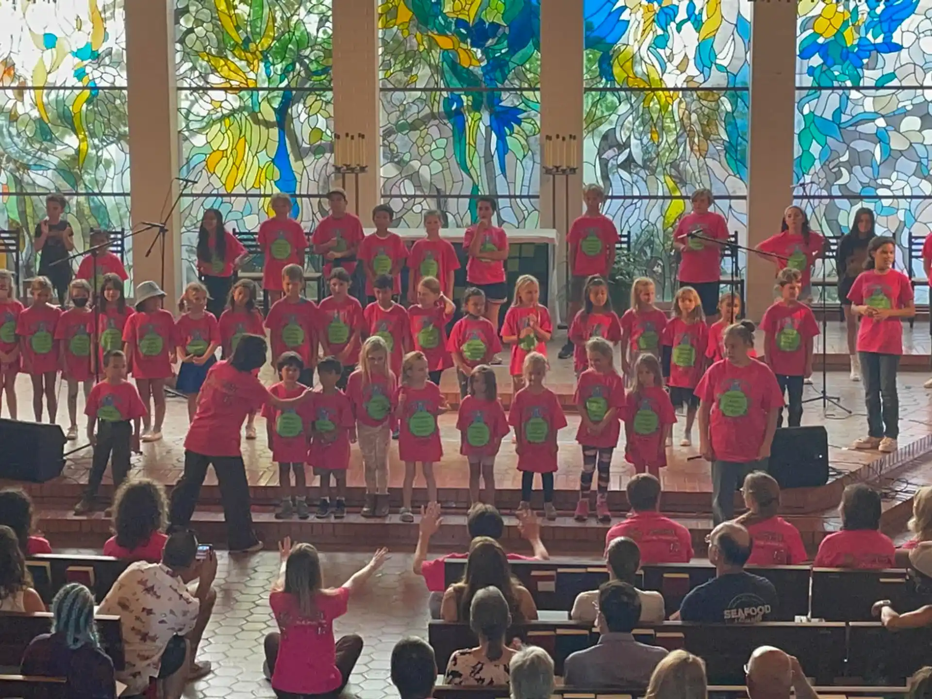 a group of children performing on stage