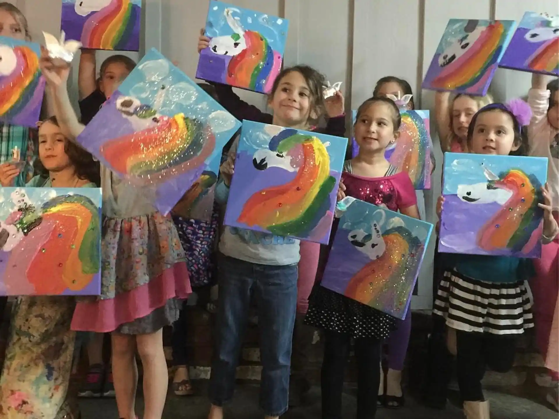 a group of girls holding colorful flags