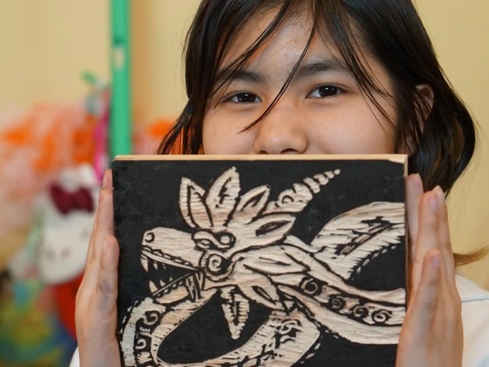 a girl holding a book