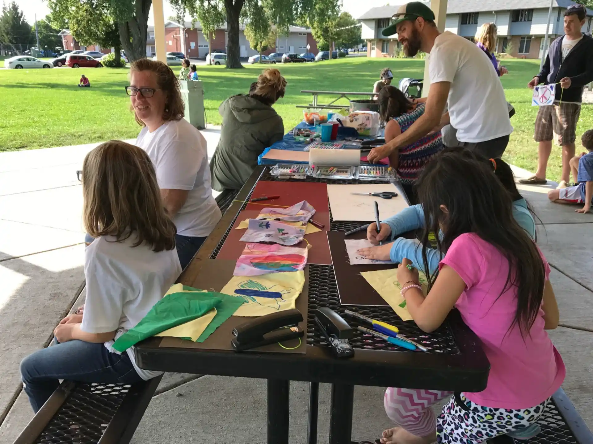 a group of people painting outside