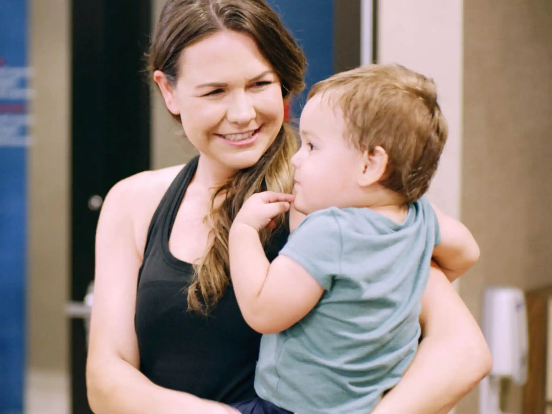 a woman holding a child