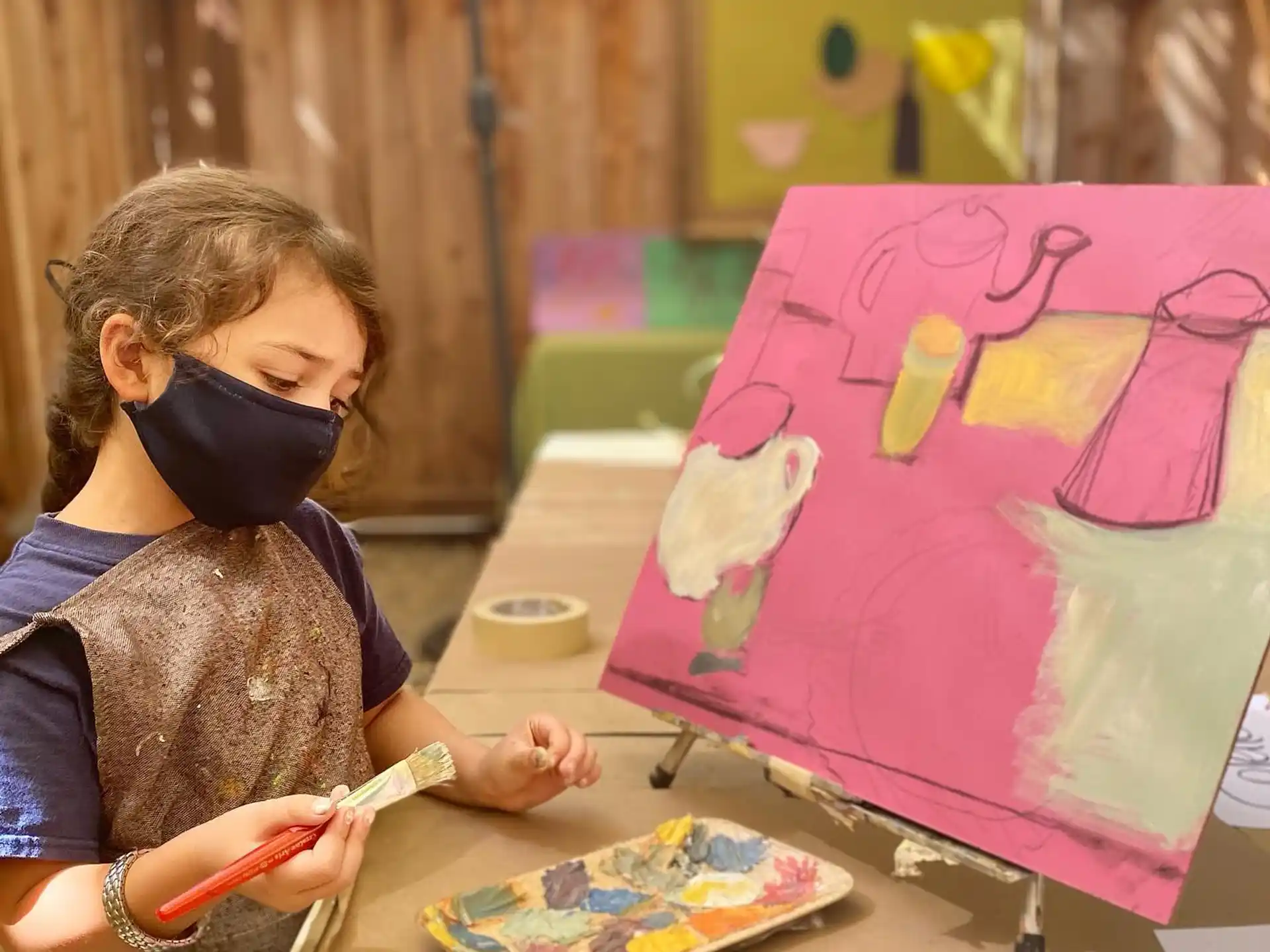 a young girl painting